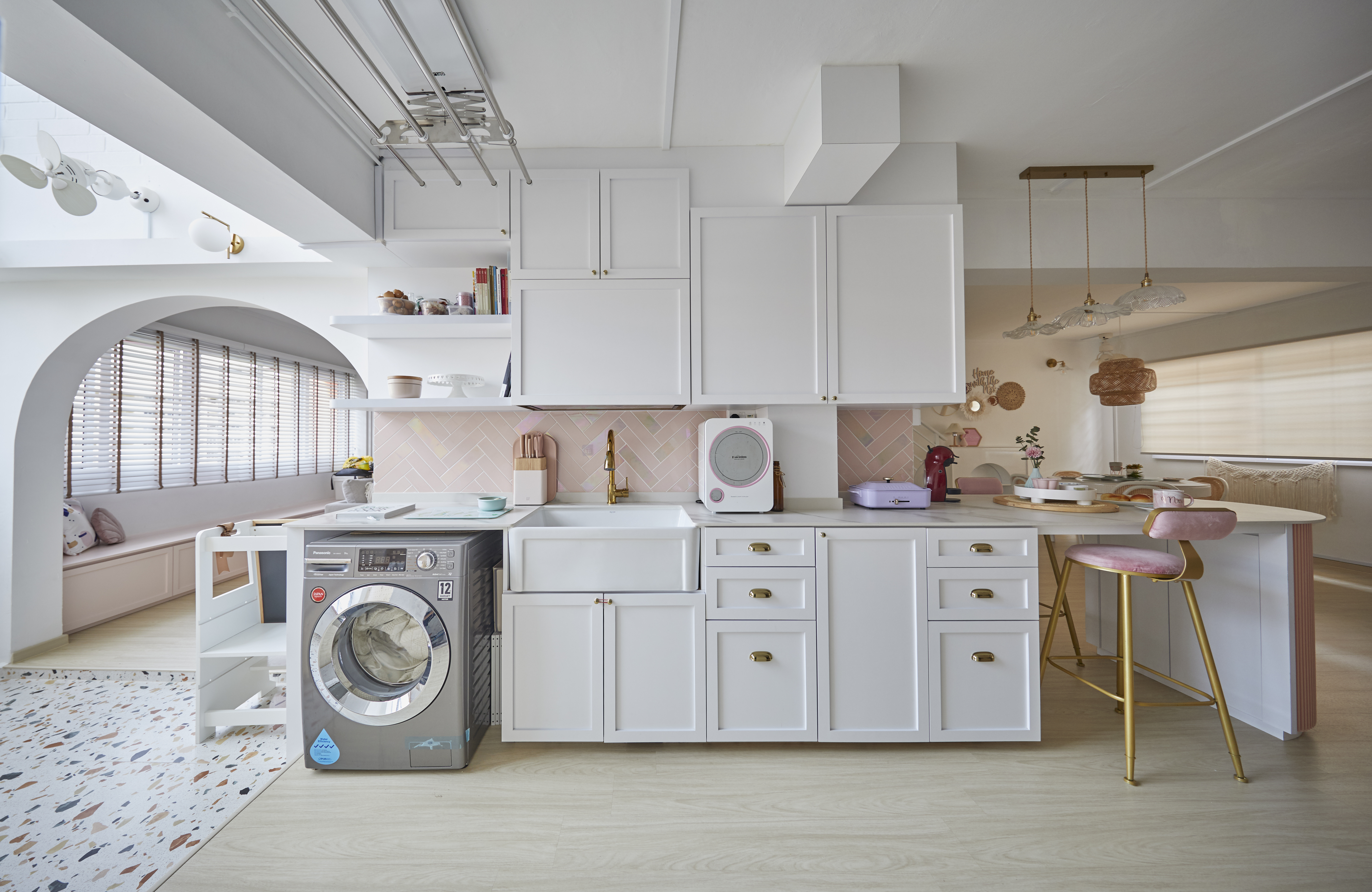 Kitchen is a heart at home. - Modern kitchen with white cabinetry, stainless steel appliances, and pink accents. Sunlight