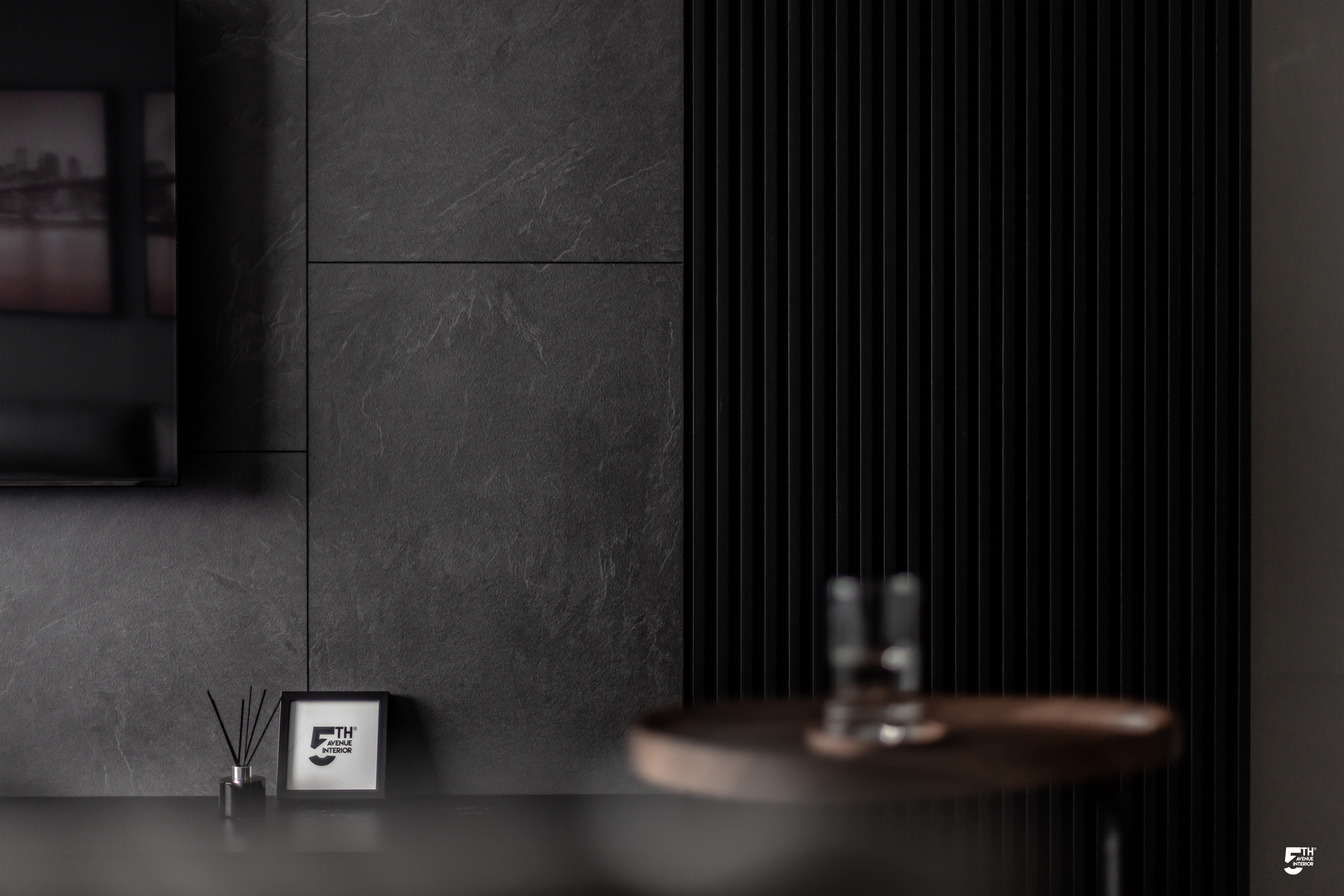 Living Room in Grey - Dark gray textured wall, minimalist decor, modern interior design, sleek furniture, abstract art, black