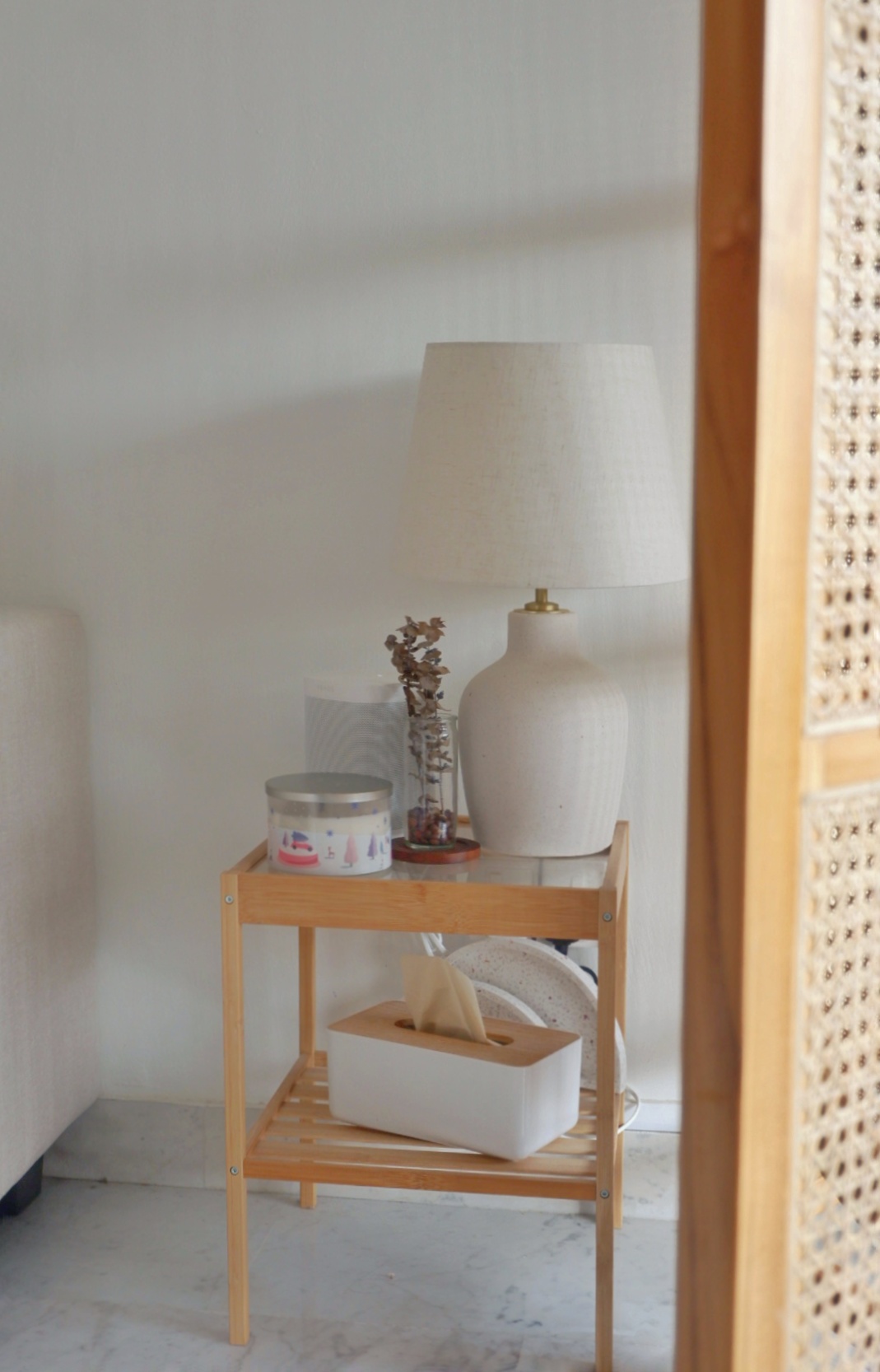 Minimalist Living Room  - Wooden side table, minimalist design, white lamp, decorative vase, candles, tissue box, white