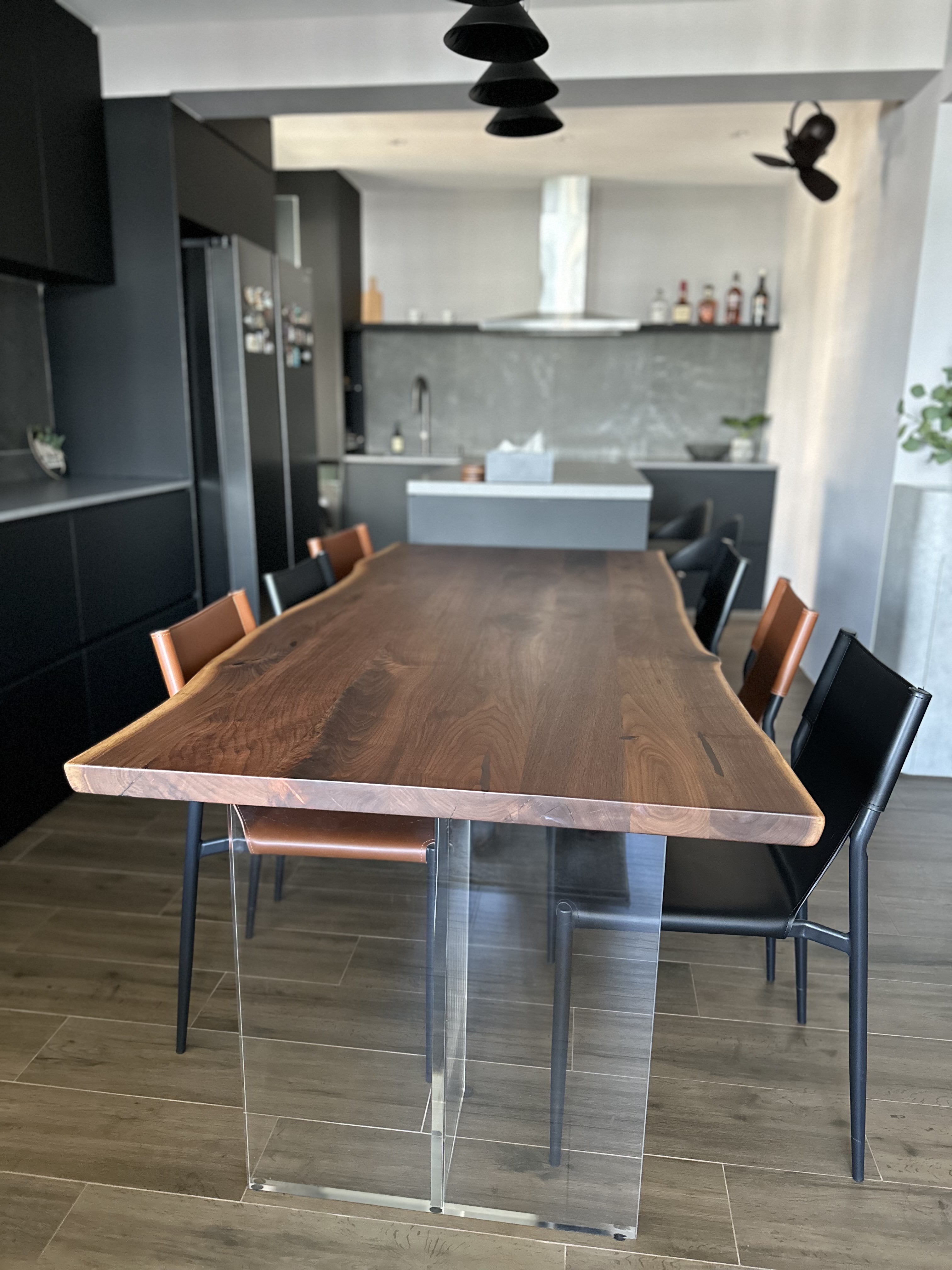 where the eating happens 😋 - modern dining room, sleek kitchen, contemporary furniture, wooden dining table, black cabinets