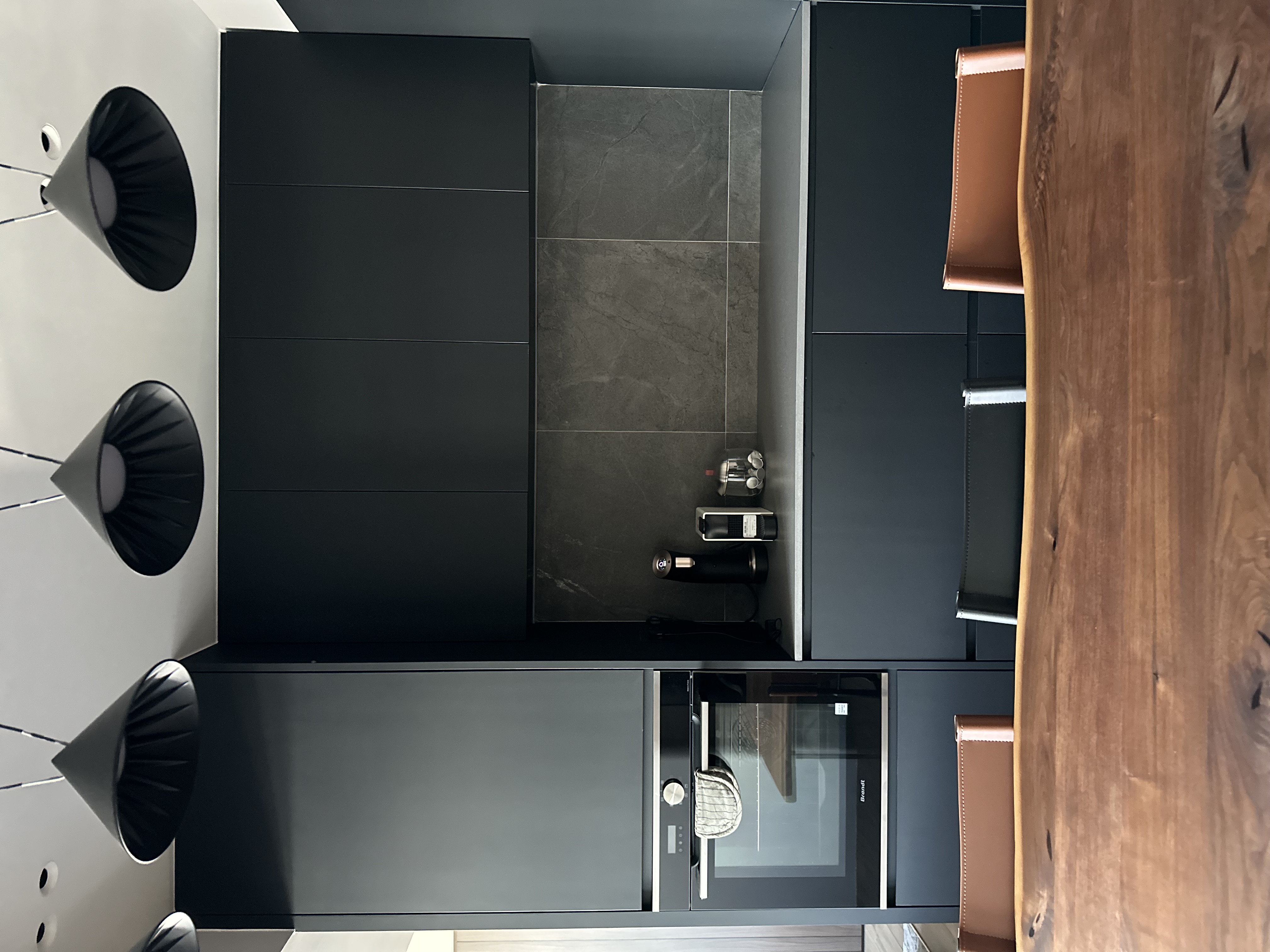 where the eating happens 😋 - Modern kitchen with sleek design, black and white color scheme, minimalist decor, large open