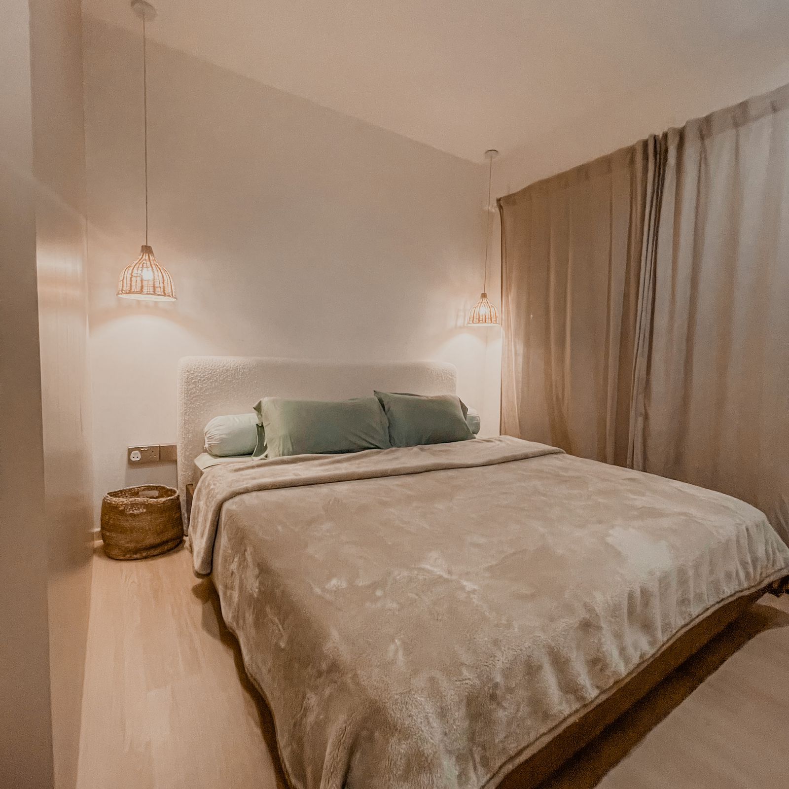 Functional Master Bedroom With A Mini Walk-In Wardrobe  - Warmly lit bedroom with beige walls, plush bed with soft bedding