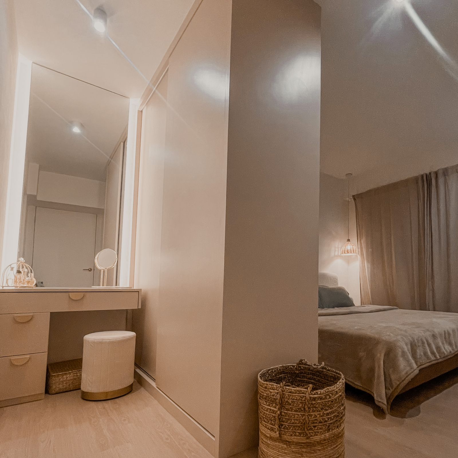 Functional Master Bedroom With A Mini Walk-In Wardrobe  - Light beige vanity with mirror, soft lighting, minimalist decor