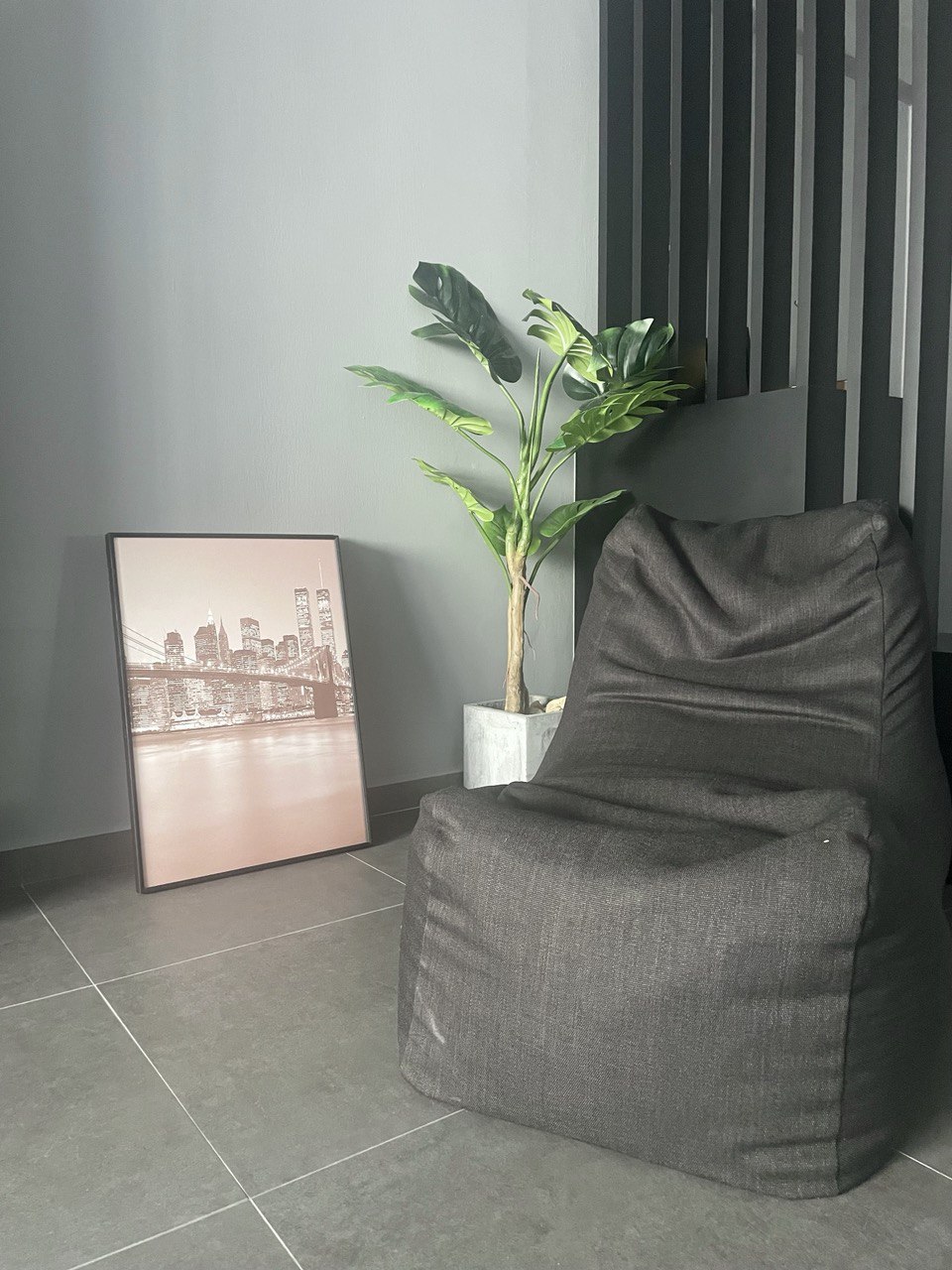 Fan-favourite cosy corners in the house - modern living room, cozy corner, gray armchair, abstract cityscape, minimalist