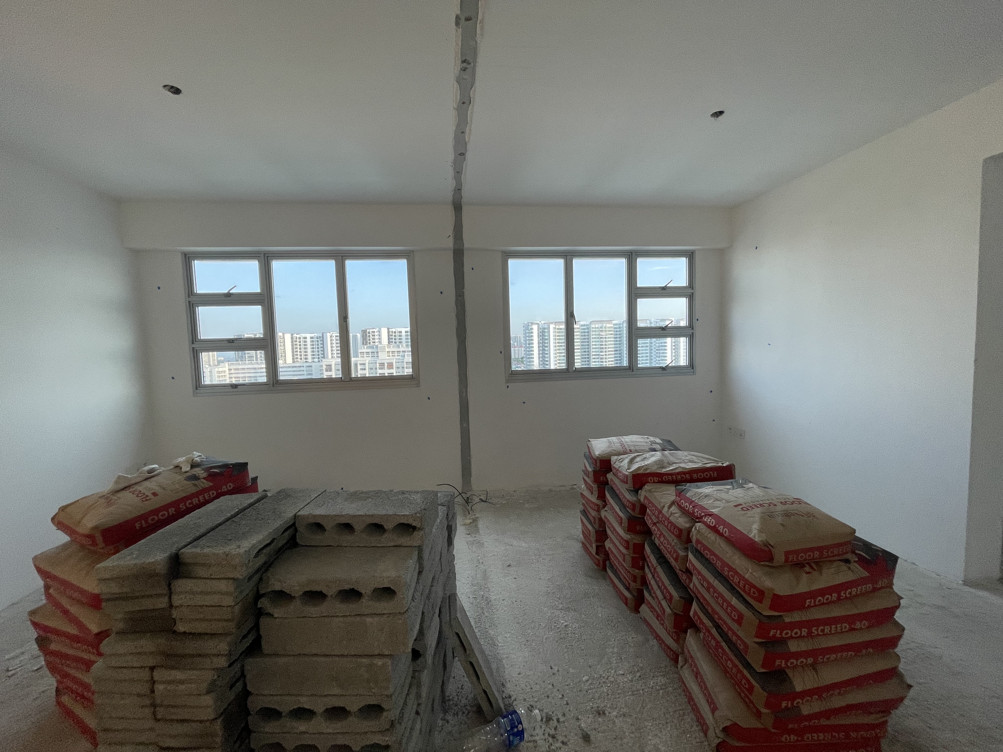 Living area - how we transformed 2 rooms into 1 - Empty room with unfinished walls and windows, Construction site with red