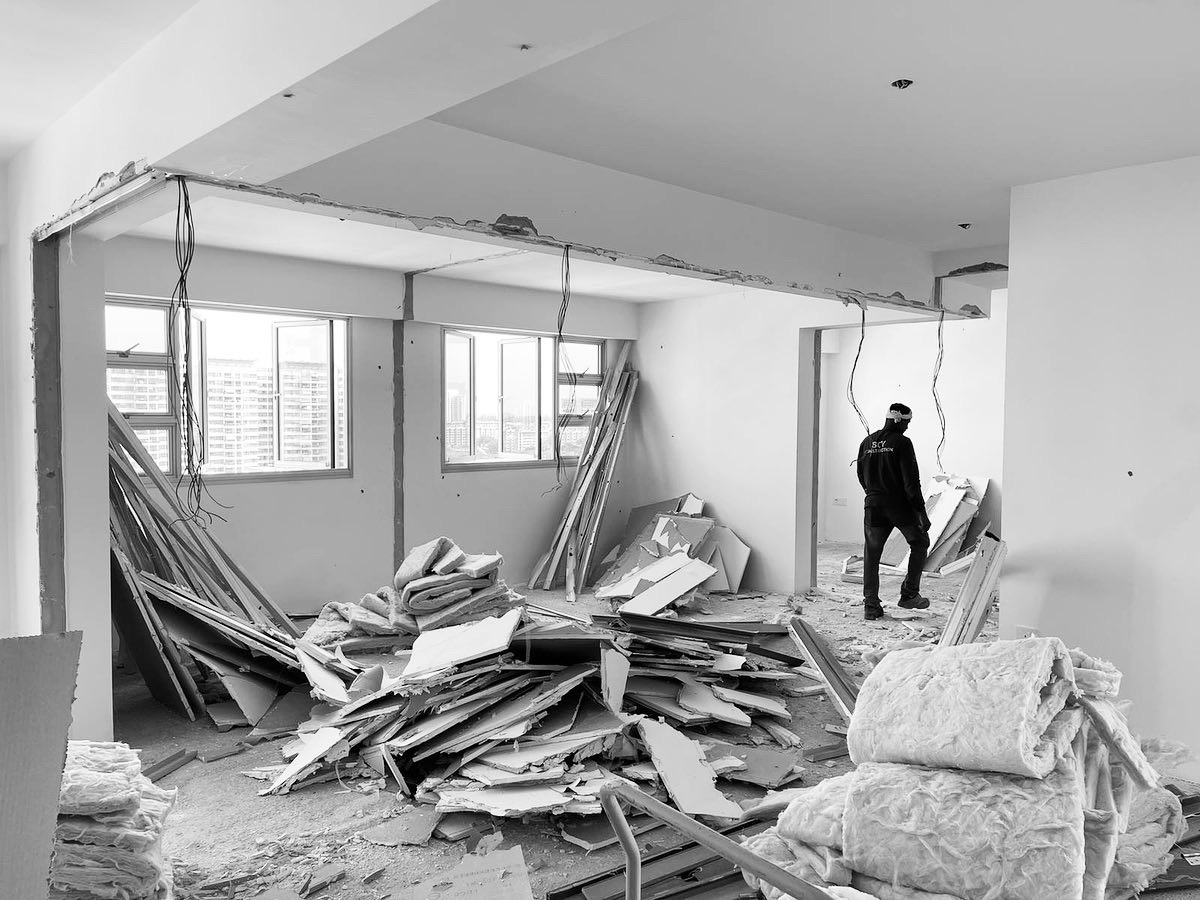 Living area - how we transformed 2 rooms into 1 - Ruins of a partially demolished room, Construction site with debris, Empty