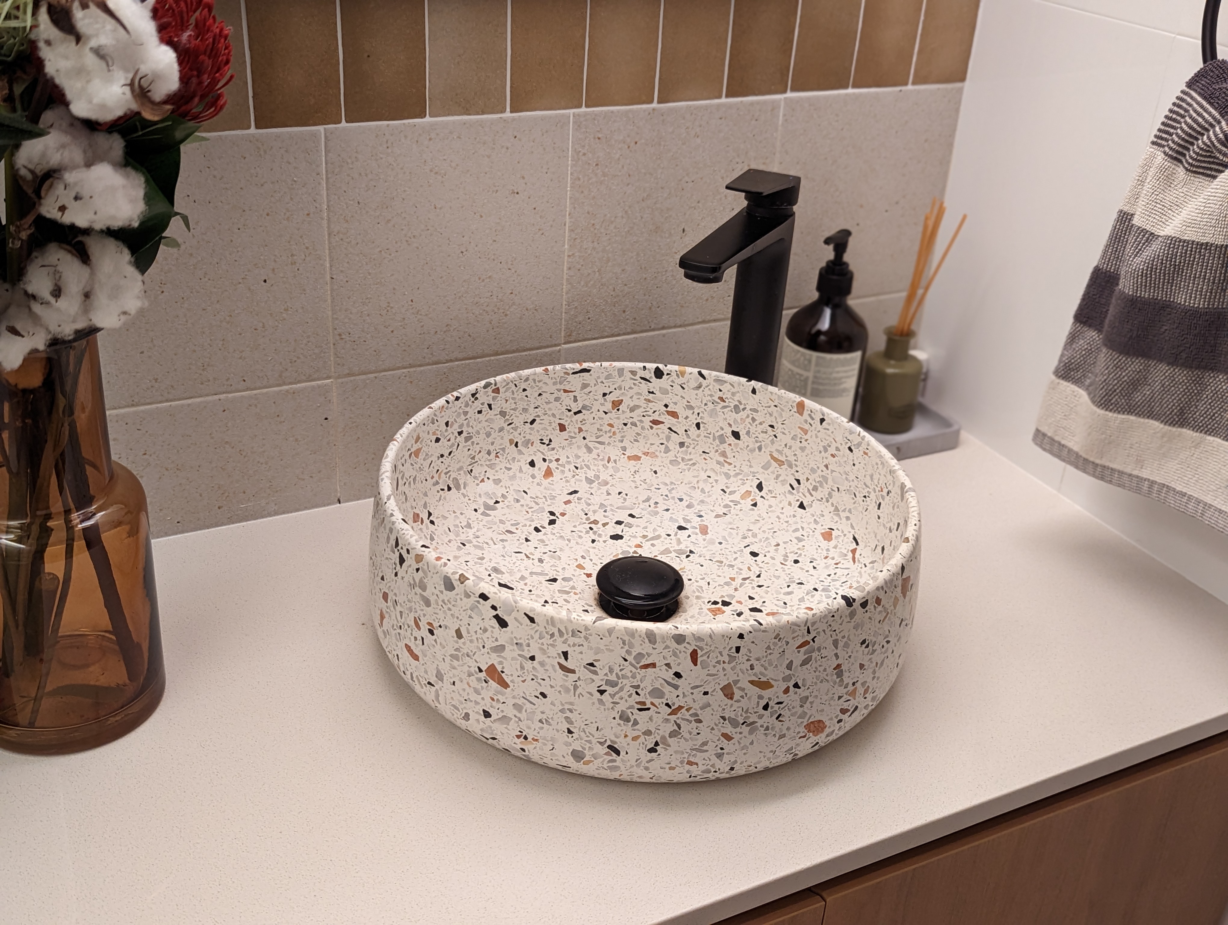 Comfort and Relief | Creating a mood for that ploop - Bathroom vanity, ceramic sink, speckled design, oval shape, white