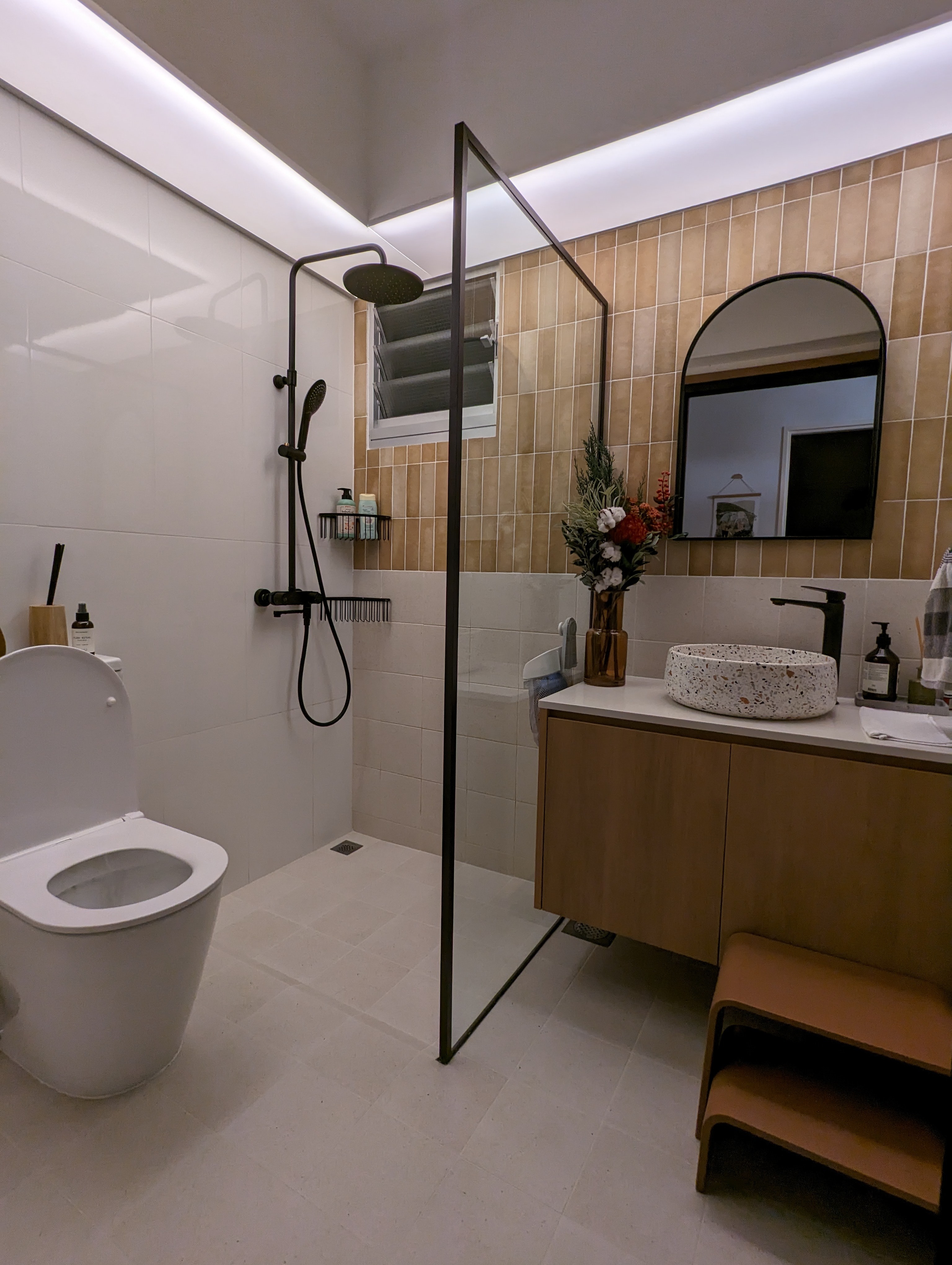 Comfort and Relief | Creating a mood for that ploop - Modern bathroom with white tiled walls and beige tiles on the lower