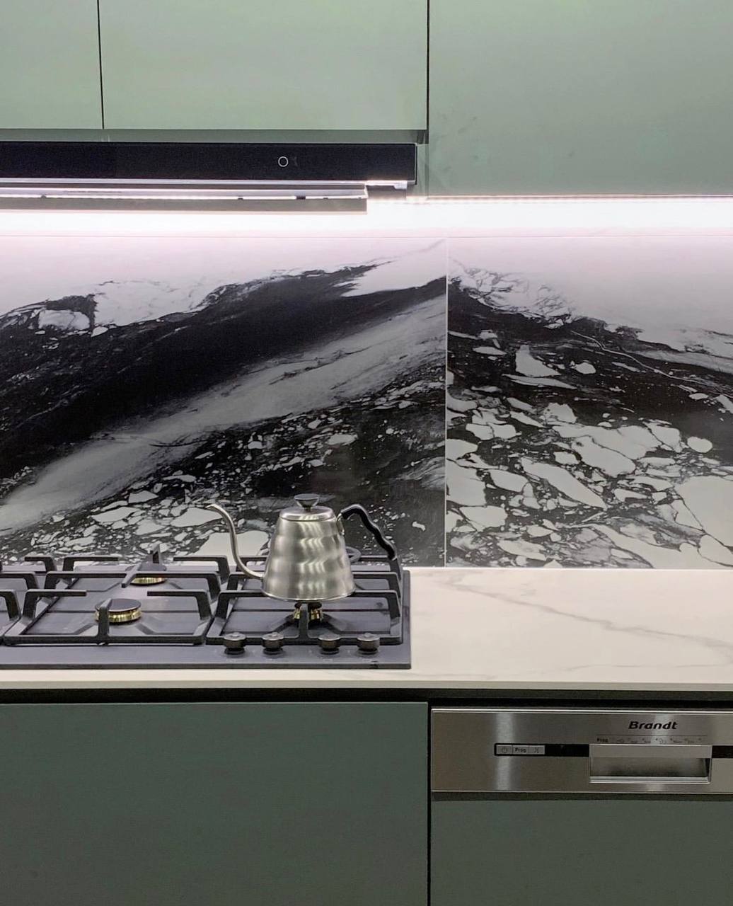 Where the wife spends most of her time at (her love for cooking). - Gas stove with modern design, stainless steel kettle