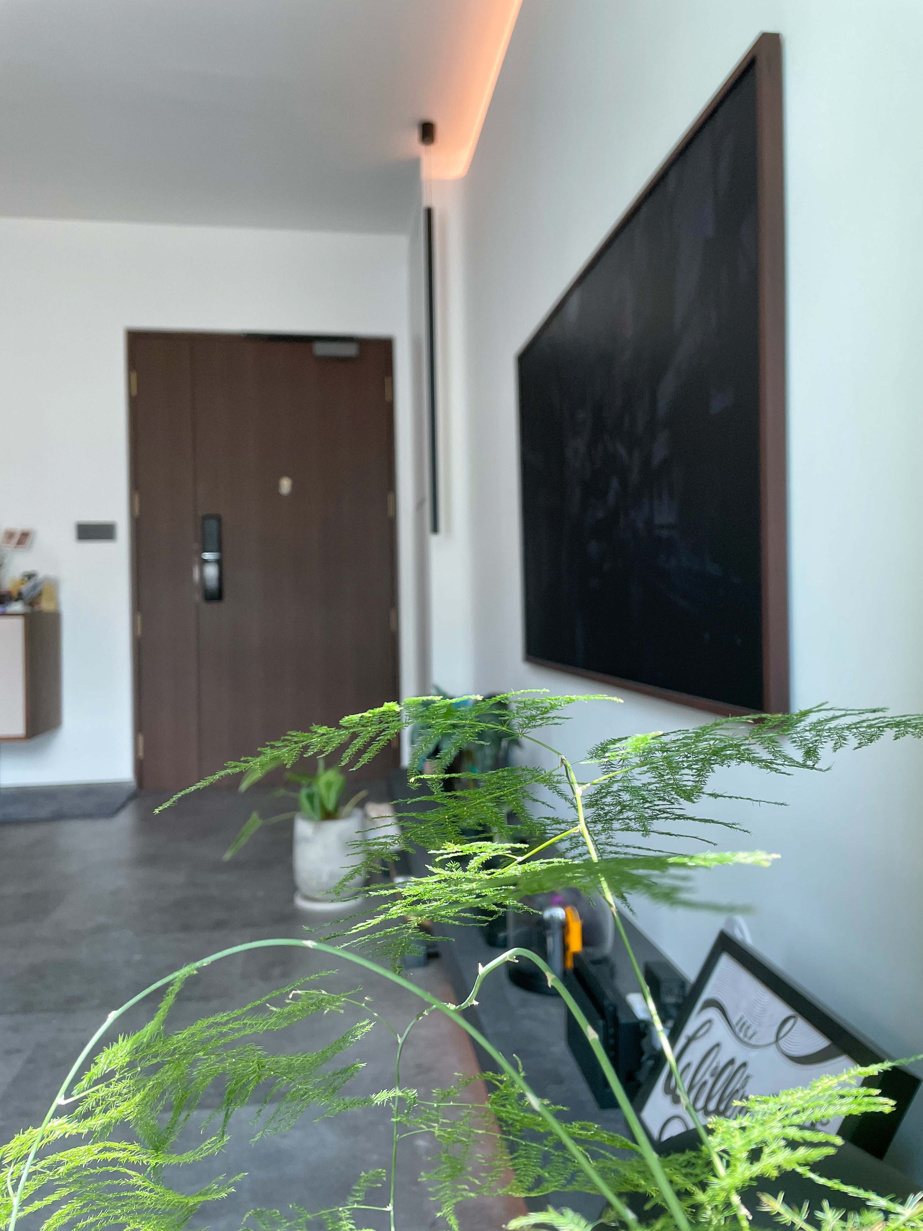 That moment when you open your door, you know you are home. - Modern living room, minimalist decor, sleek wall art, large