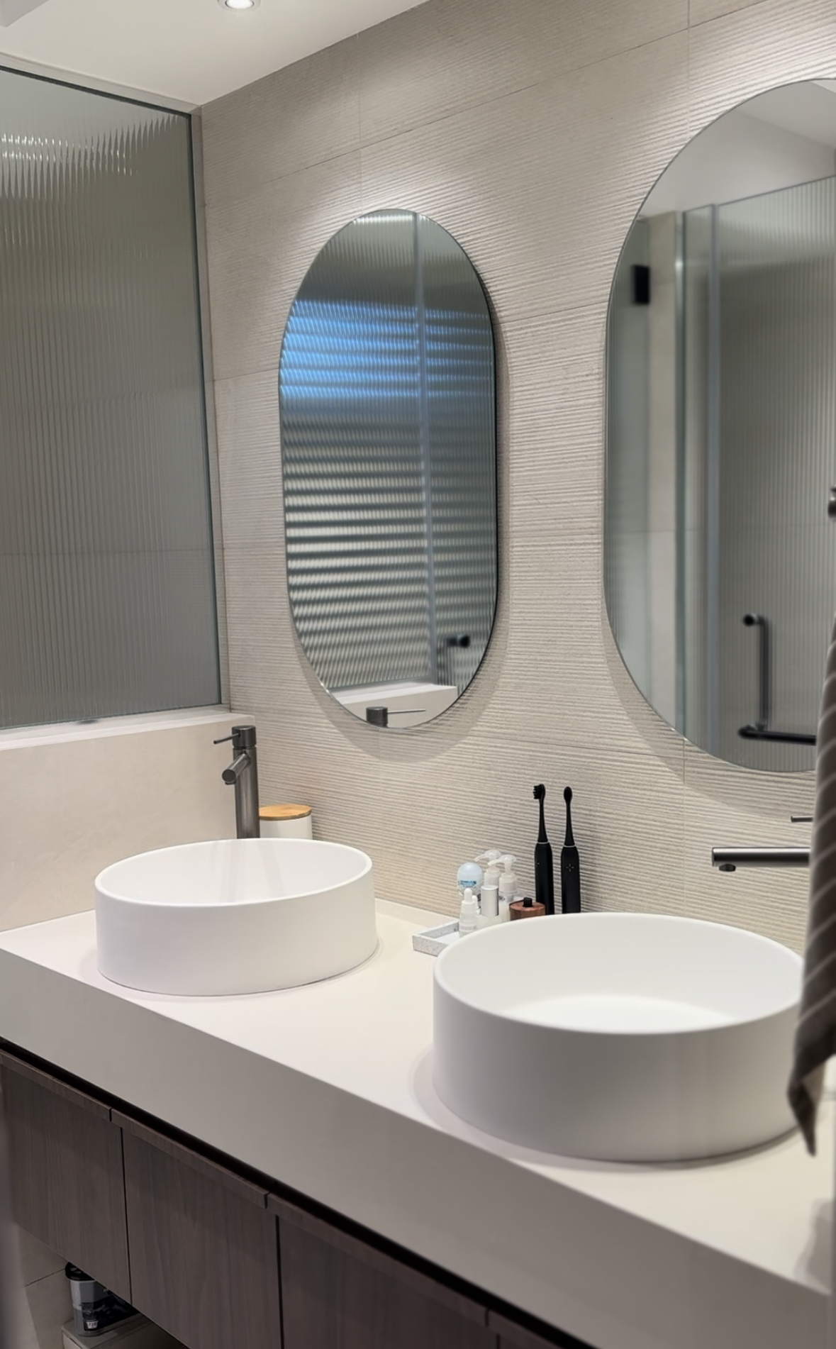 Master bathroom with double sinks  - Modern bathroom vanity, sleek design, minimalist decor, floating sinks, large mirror