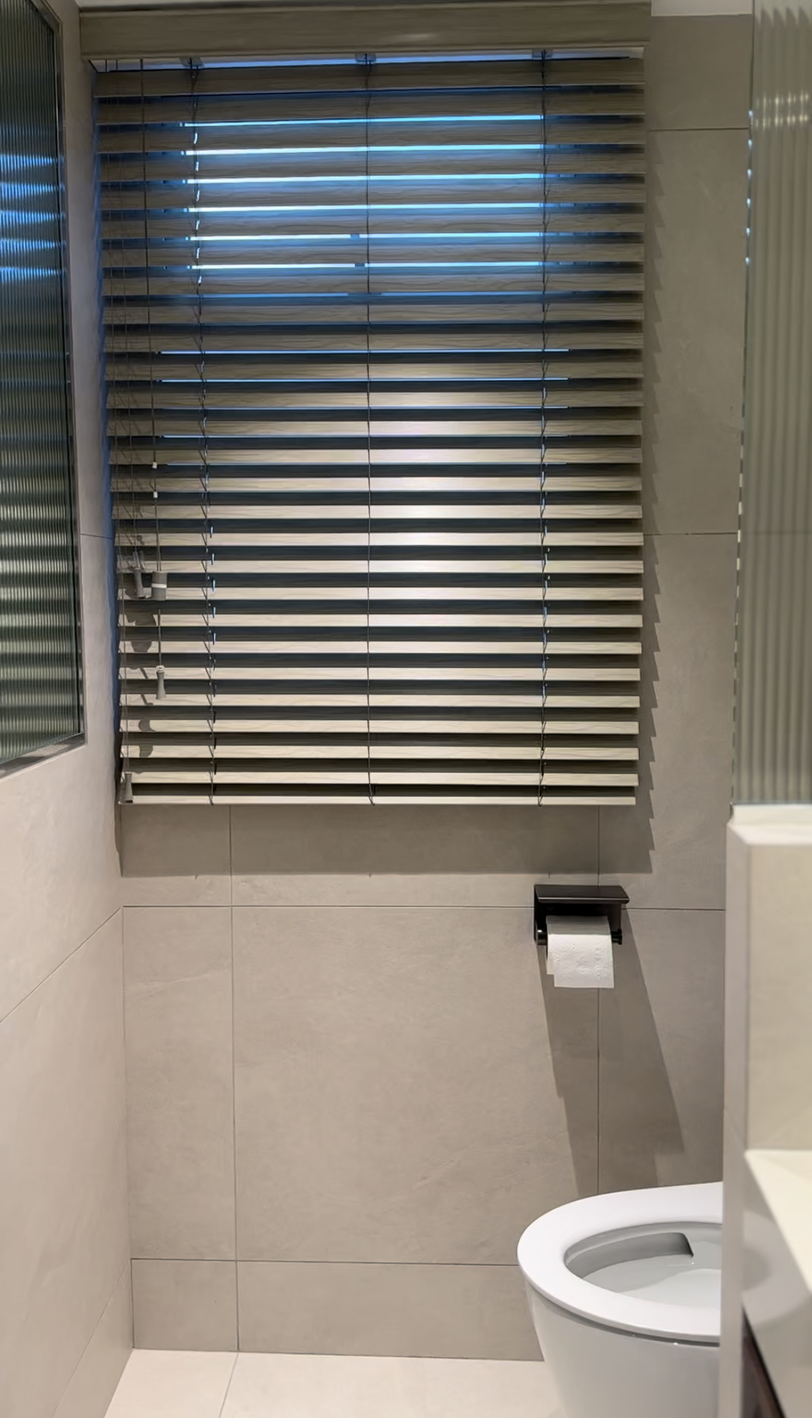 Master bathroom with double sinks  - Modern bathroom interior, minimalist design, large window with blinds, beige tiles