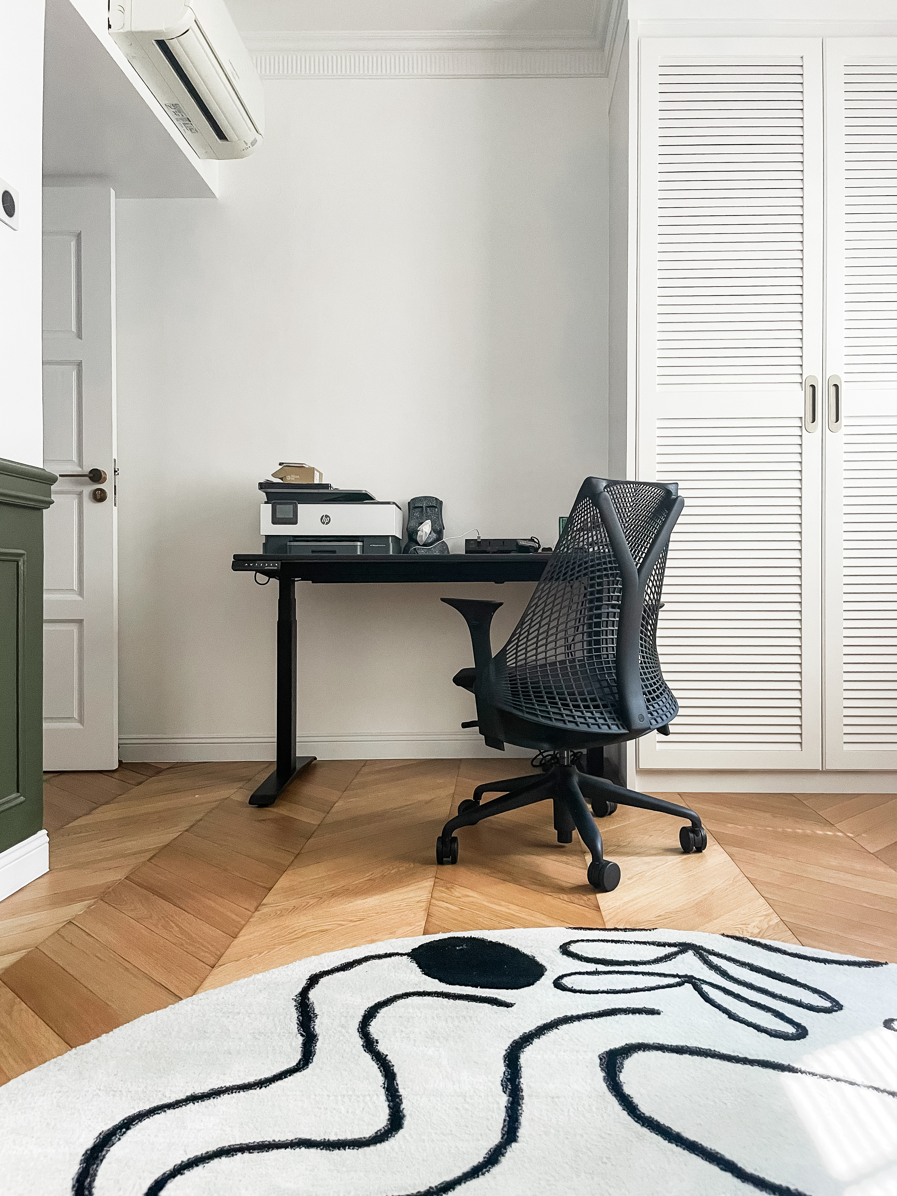 The Perfect Harmony: Multi-Purpose Study and Piano Room - White office chair, black office desk, white louvered closet doors