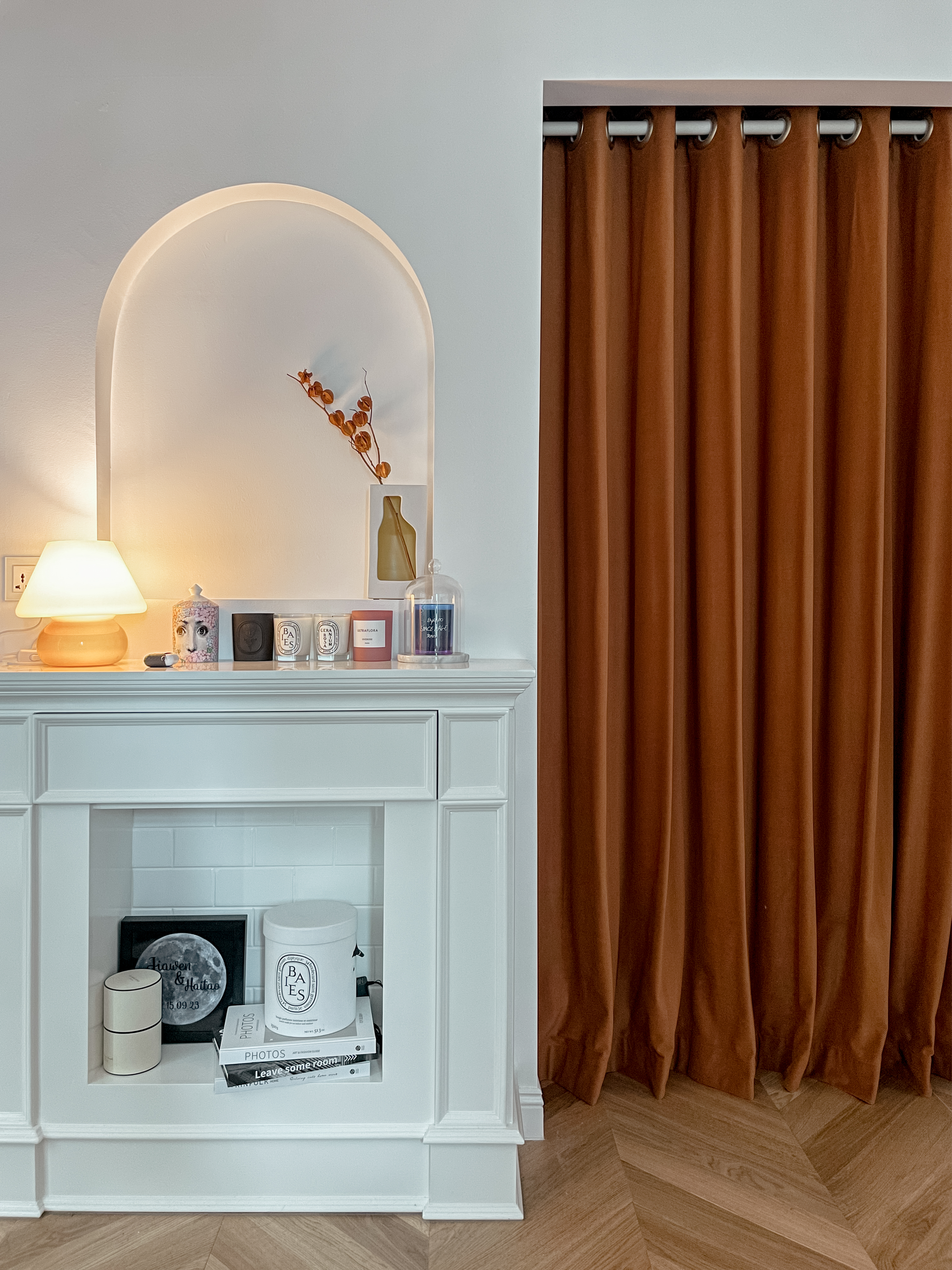 From Ordinary to Extraordinary: Our Master Bedroom Makeover - White mantelpiece, brown curtains, soft lighting, minimalist