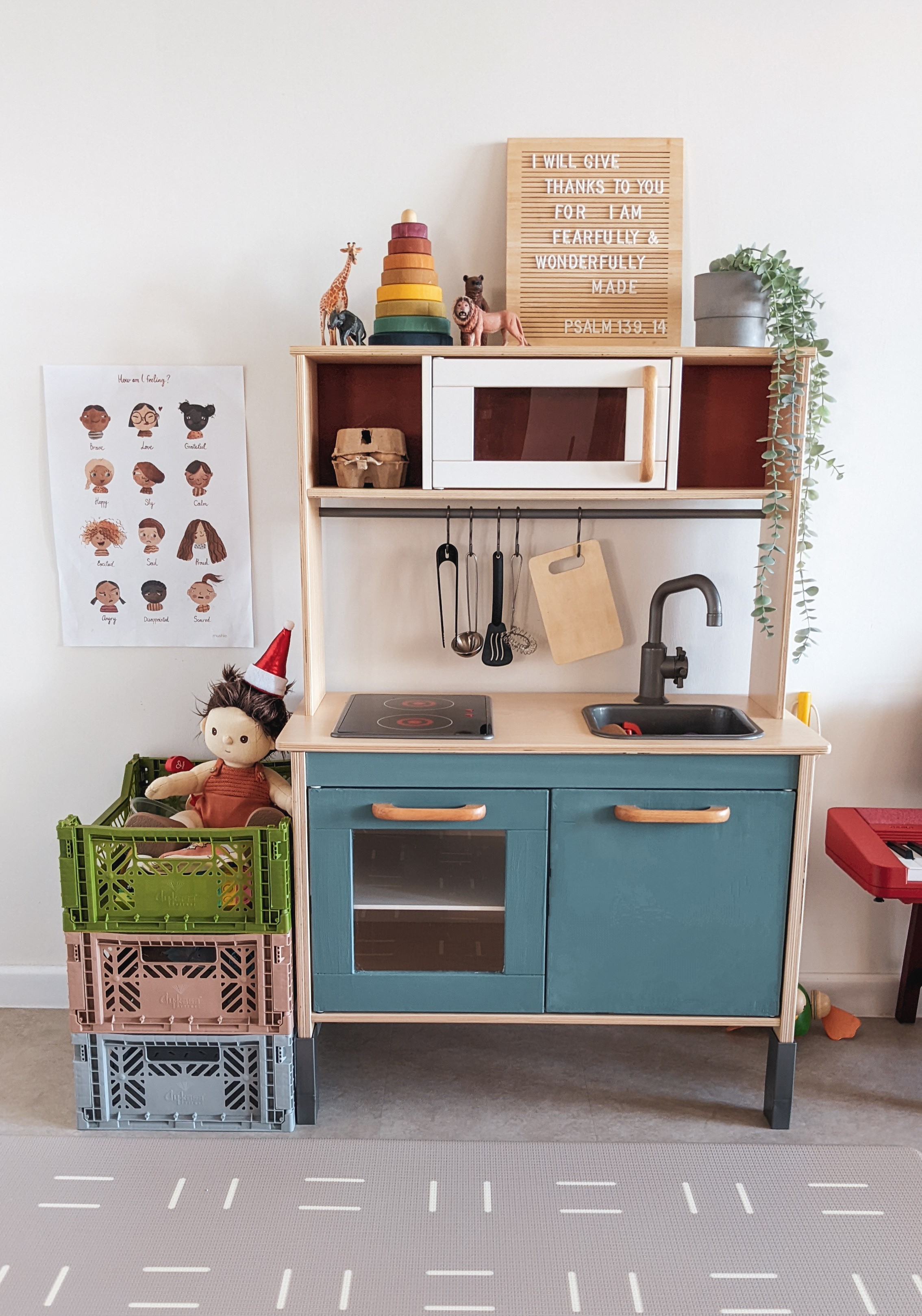 A Canvas for Imagination | Space for play and creativity - Children's play kitchen with wooden cabinets and drawers, colorful