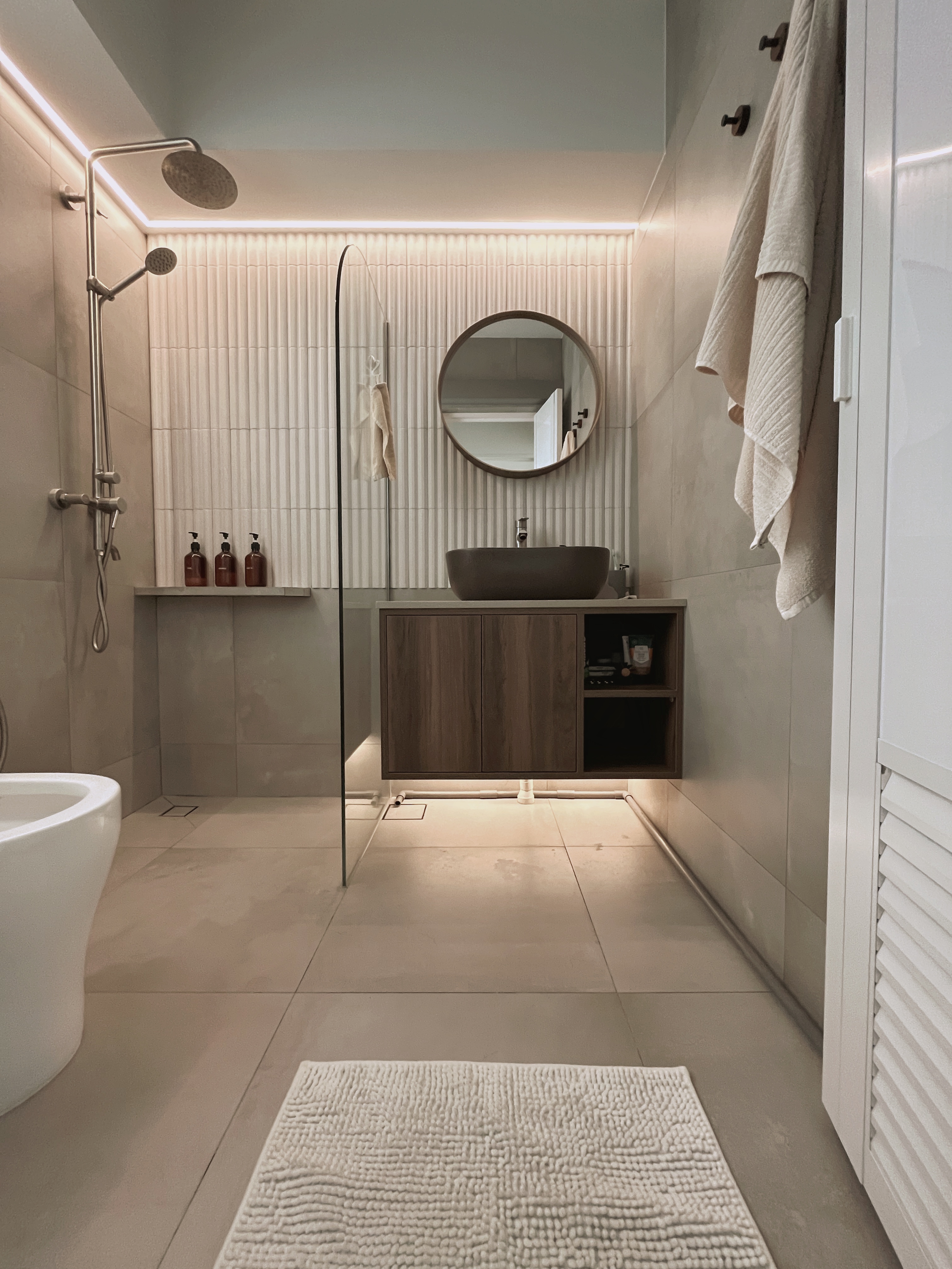 12 Bathroom Renovation Tips We Learned - Modern minimalist bathroom, sleek design, neutral color palette, large mirror