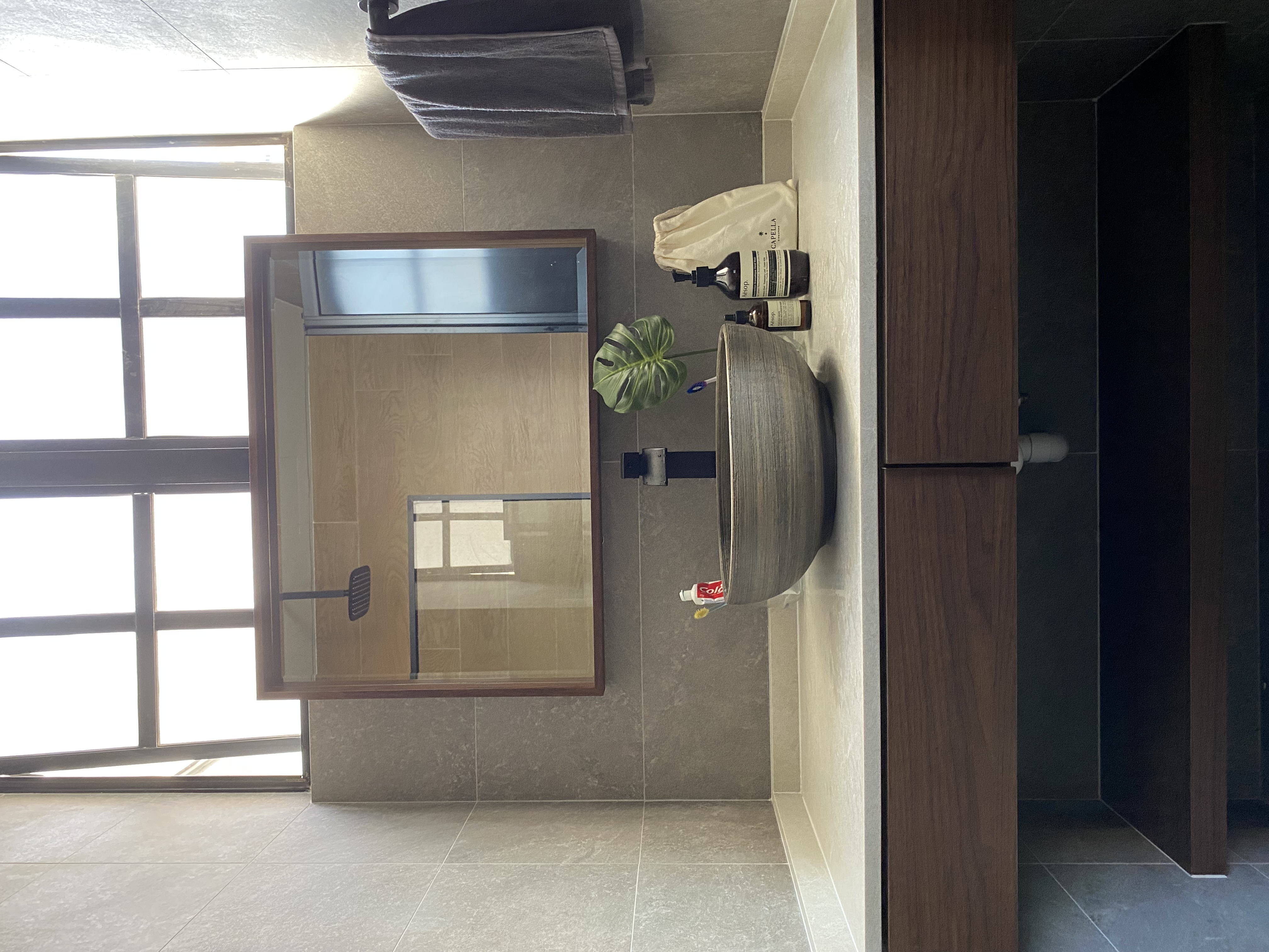 Love walnut wood in bathrooms!