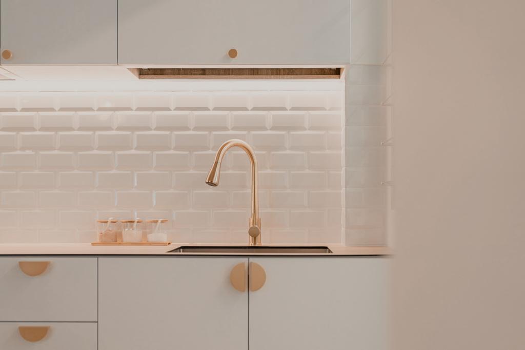 A Simple Kitchen For All Your Possible Needs  - White subway tile backsplash, minimalist kitchen design, modern faucet, light