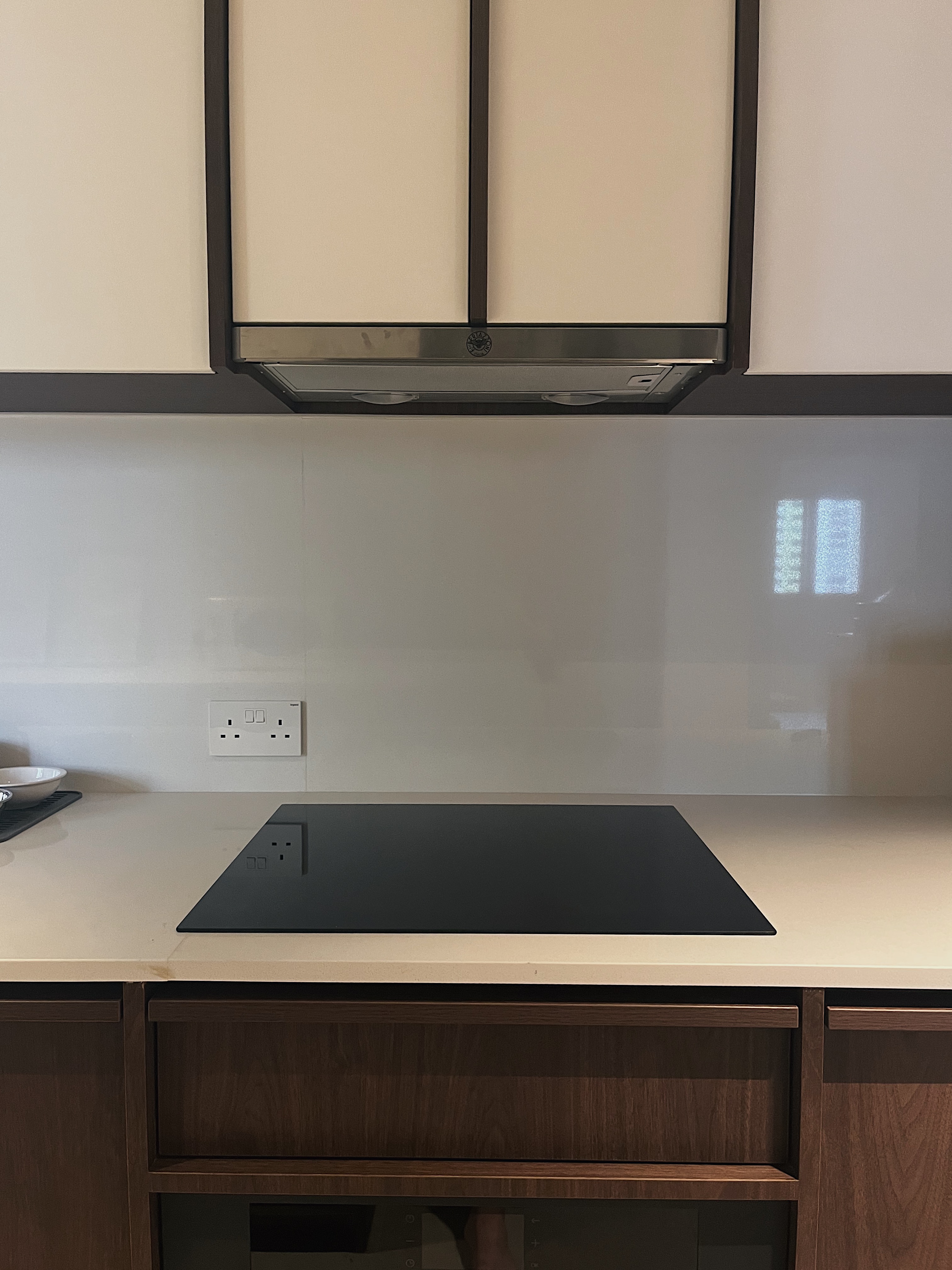 Spacious & Airy Kitchen For All Your Cooking Needs  - modern kitchen countertop, sleek cabinets, minimalist design, black