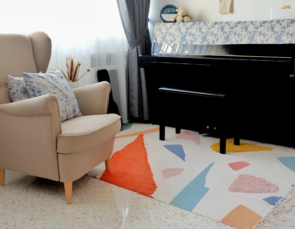 A Room Where Music Comes Alive  - Cream upholstered armchair, blue floral pillows, beige armchair, white and blue floral