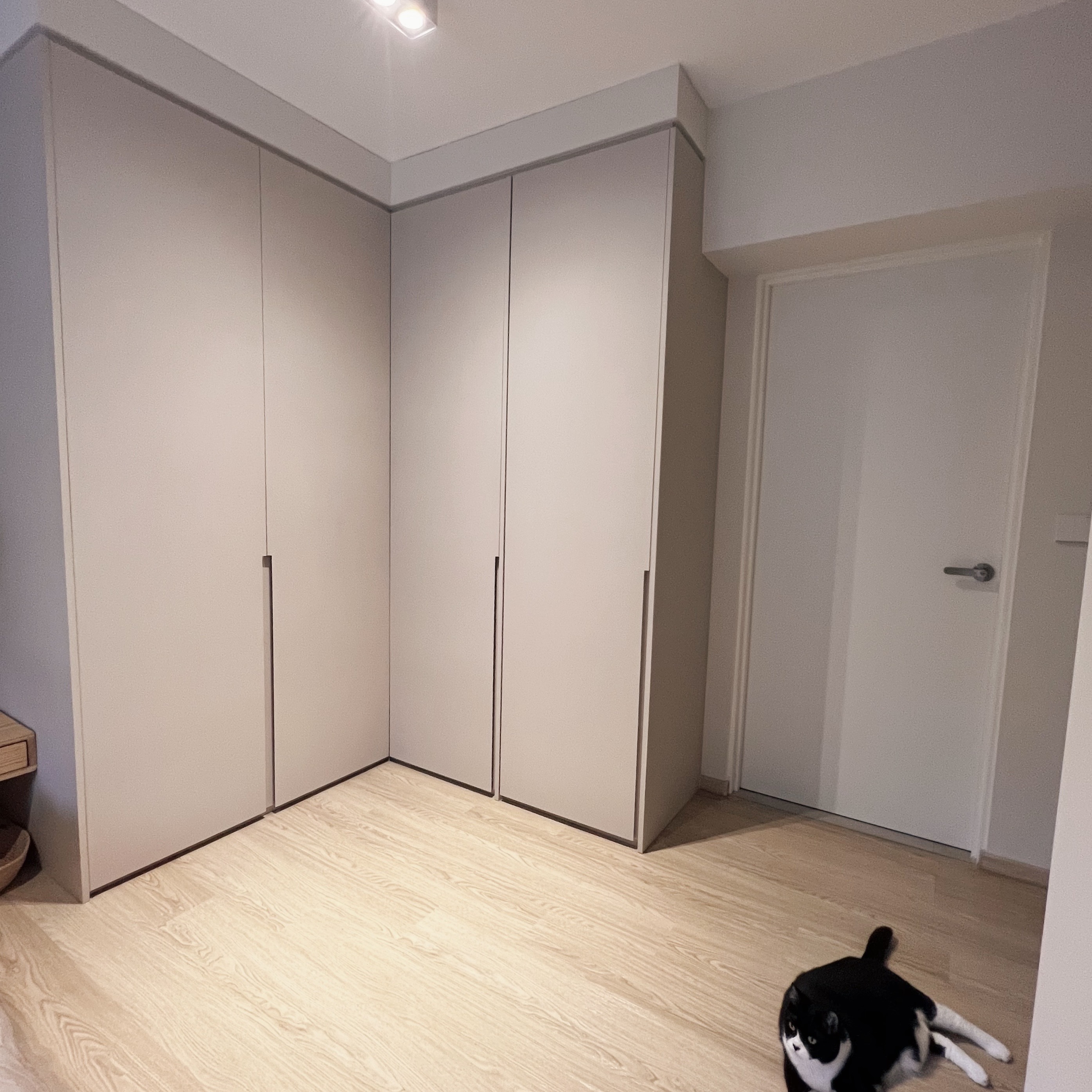 Calmness defined: Our minimalist bedroom sanctuary  - Light wood laminate flooring, modern wardrobe, white cabinets