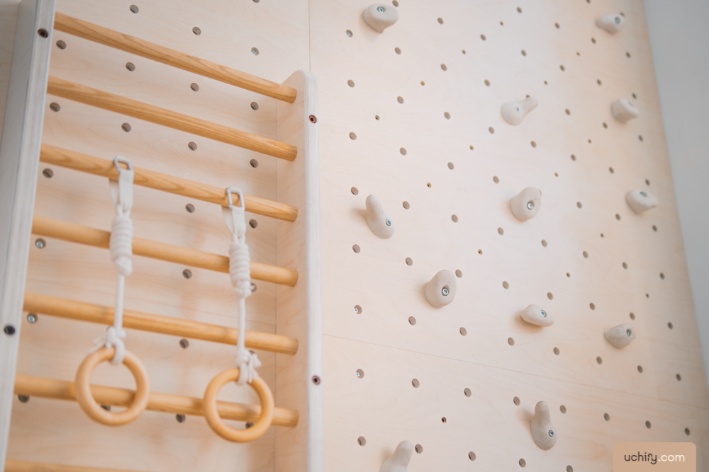 Create an “indoor” open concept play corner  - Wooden climbing wall with various climbing holds, wooden handrail with two