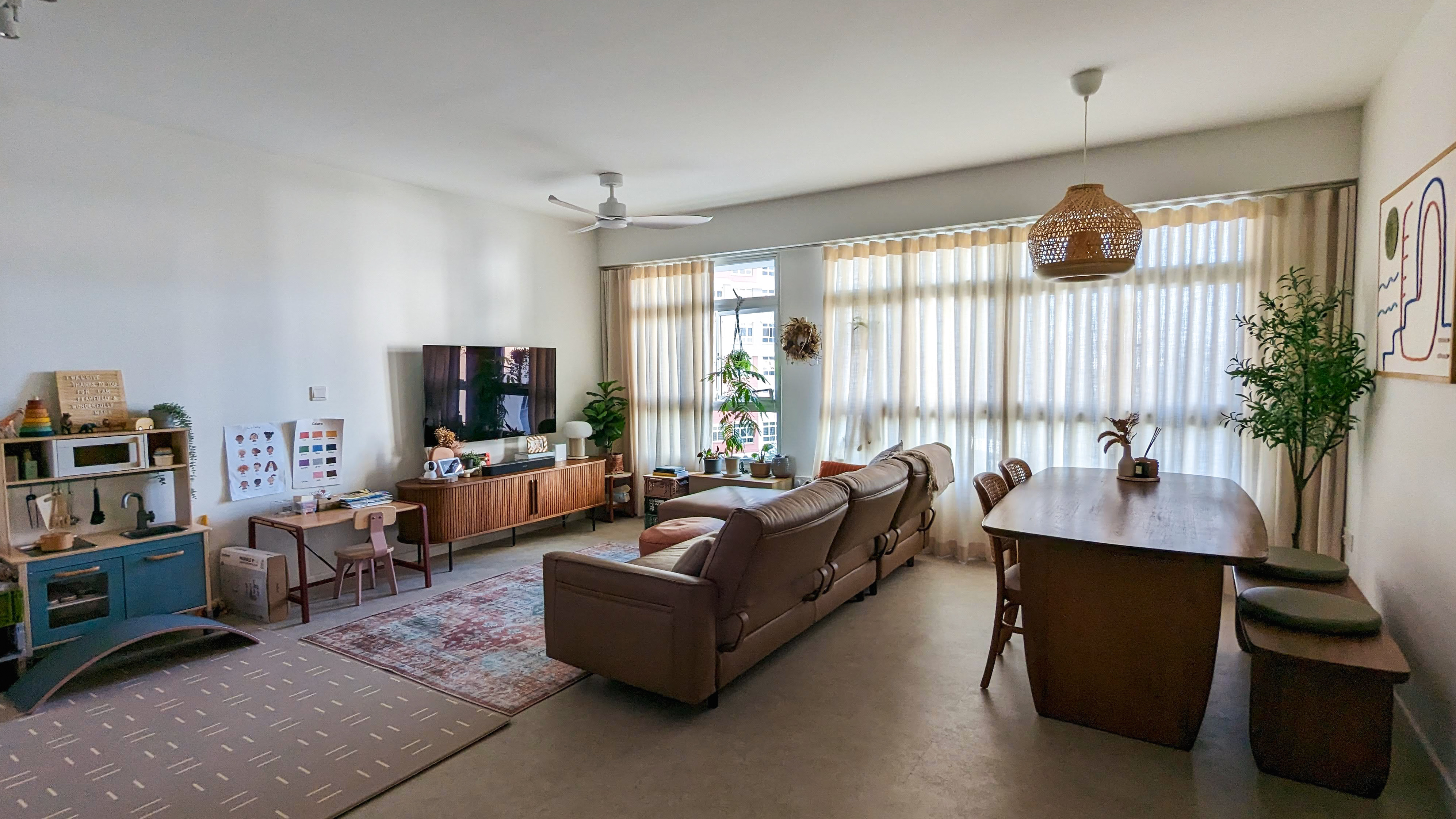 Living Space | More space, more life - Children's play kitchen area, cozy living room, modern furniture, brown leather sofa