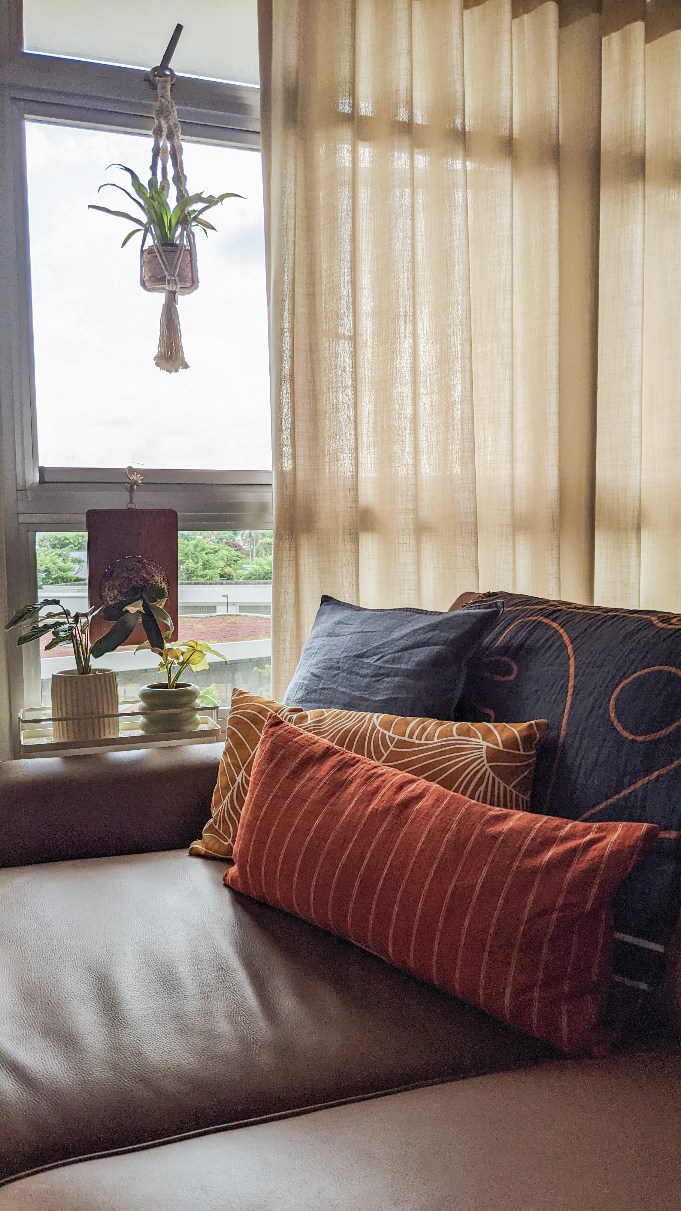 Living Space | More space, more life - Couch, cushions, plants, hanging decoration, sheer curtains, natural light, indoor