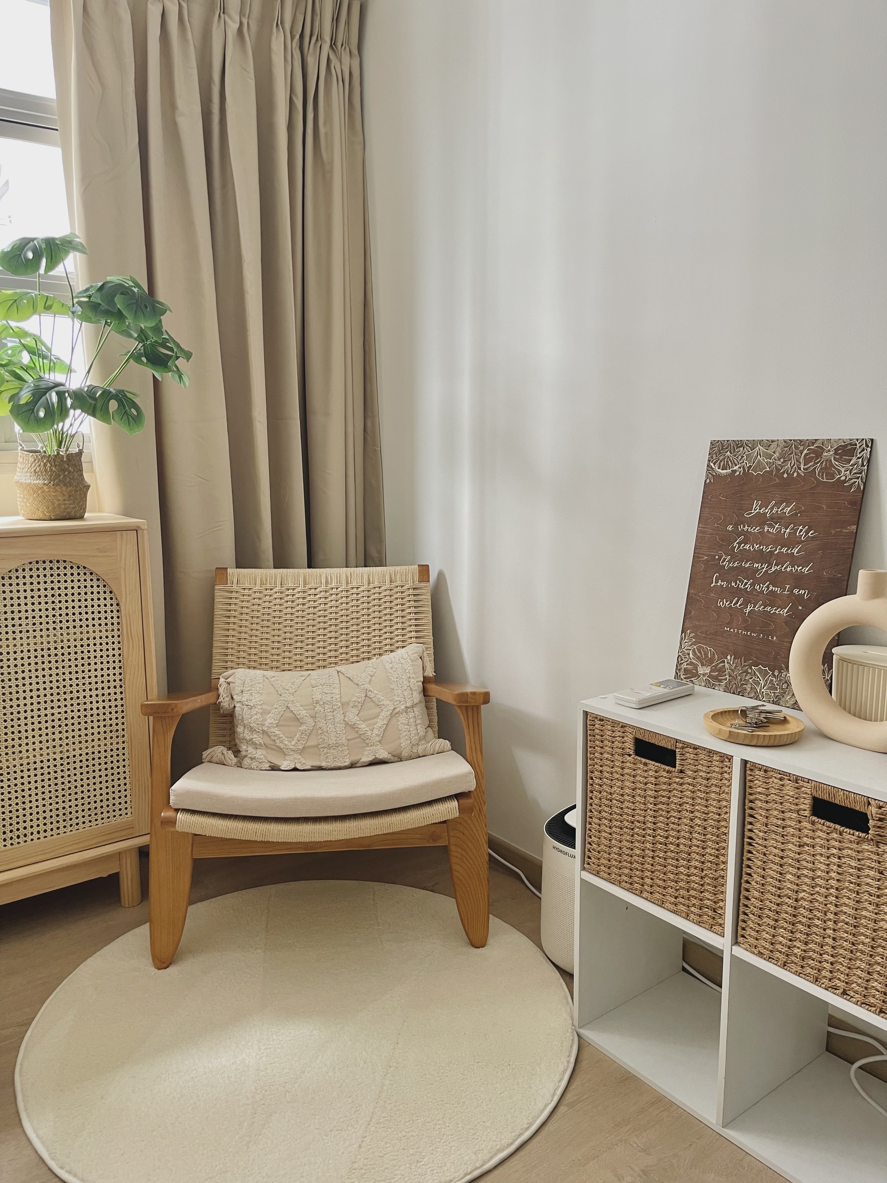 Different ways we styled our Cosy Corner - Woven chair, beige cushions, natural light, indoor plants, wooden cabinet, woven