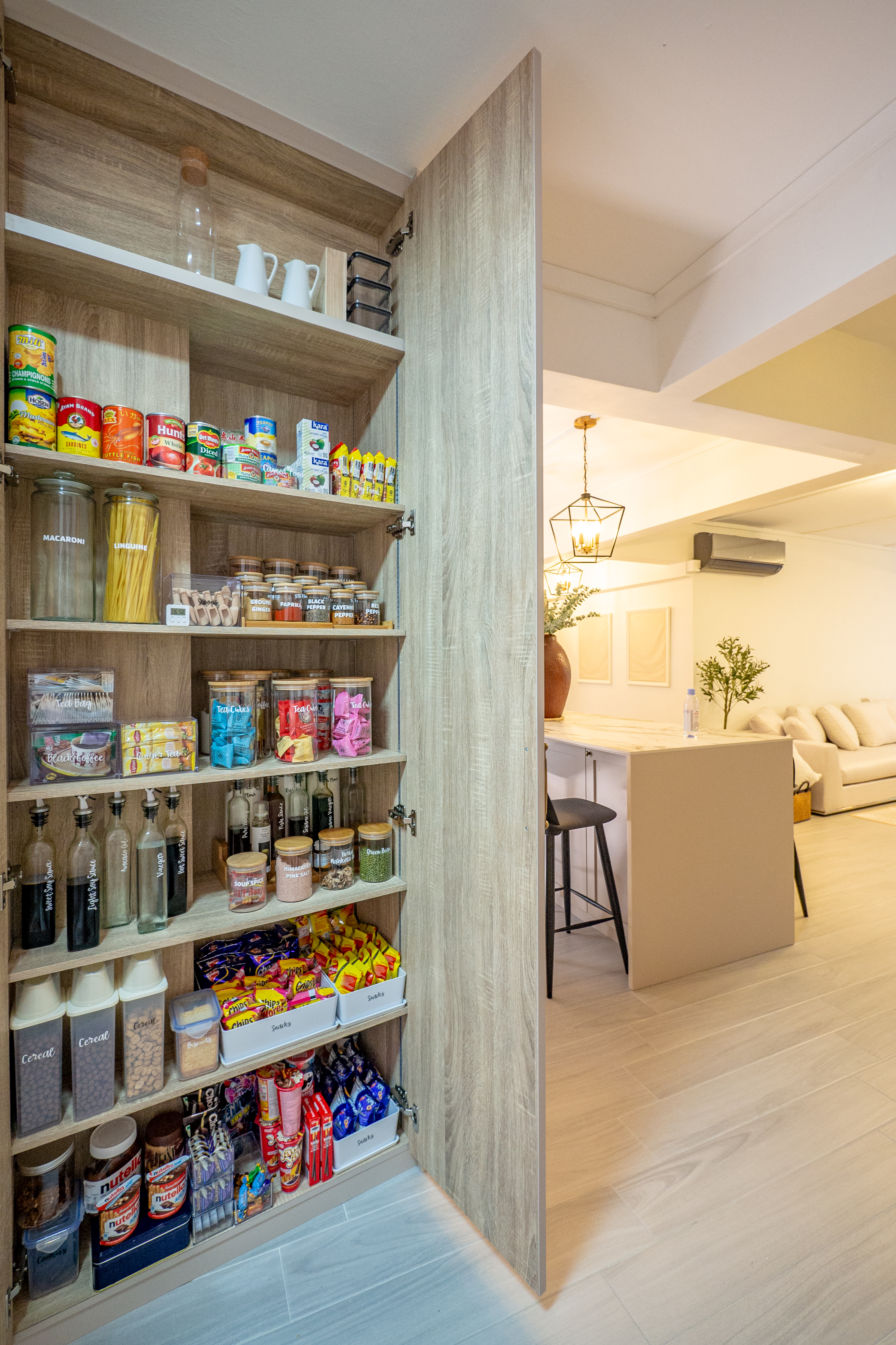 Fusing Aesthetics & Function For All Your Kitchen Storage Needs  - Wooden pantry shelves stocked with various food items