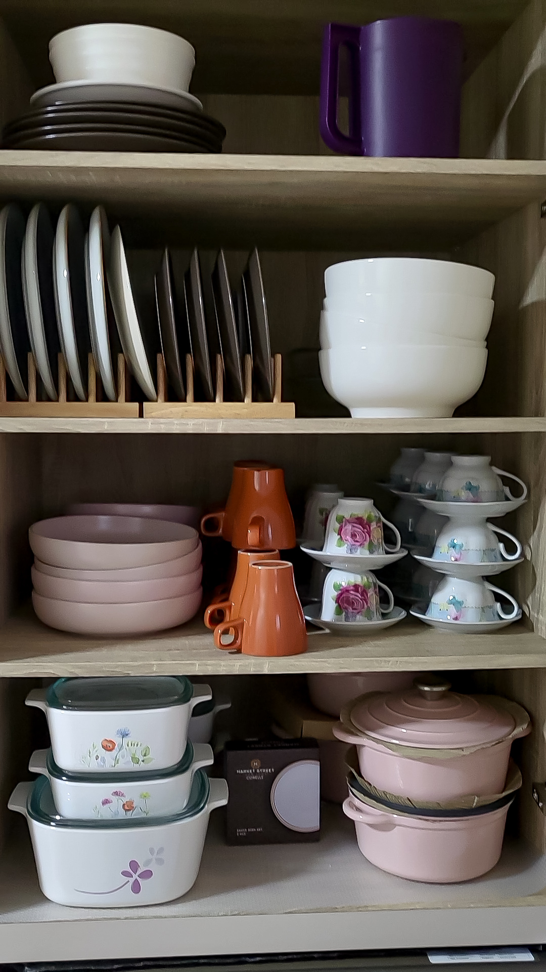 Fusing Aesthetics & Function For All Your Kitchen Storage Needs  - White and black plates, brown plates, purple mug, white