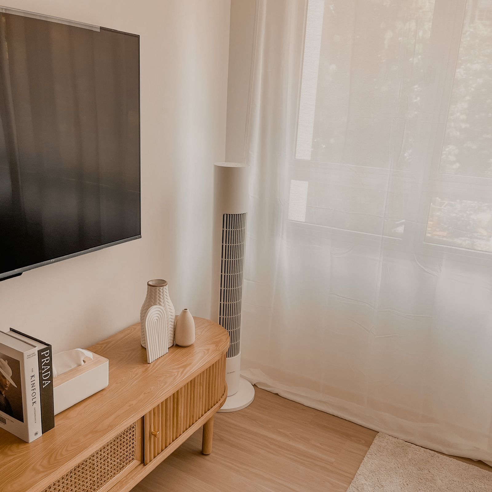 Spacious & Serene Living Room - Wooden TV stand, modern decor, minimalist design, soft lighting, large window, sheer