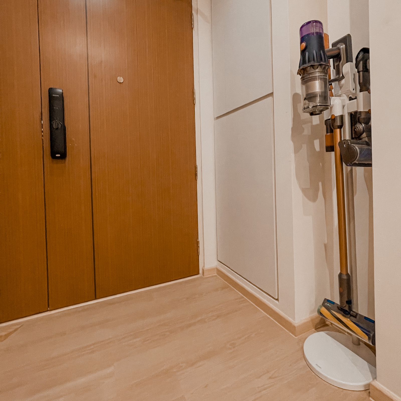 Chic & Curvalicious Entrance Foyer  - Wooden cabinet, brown door, hallway, light wooden floor, vacuum cleaner, cleaning