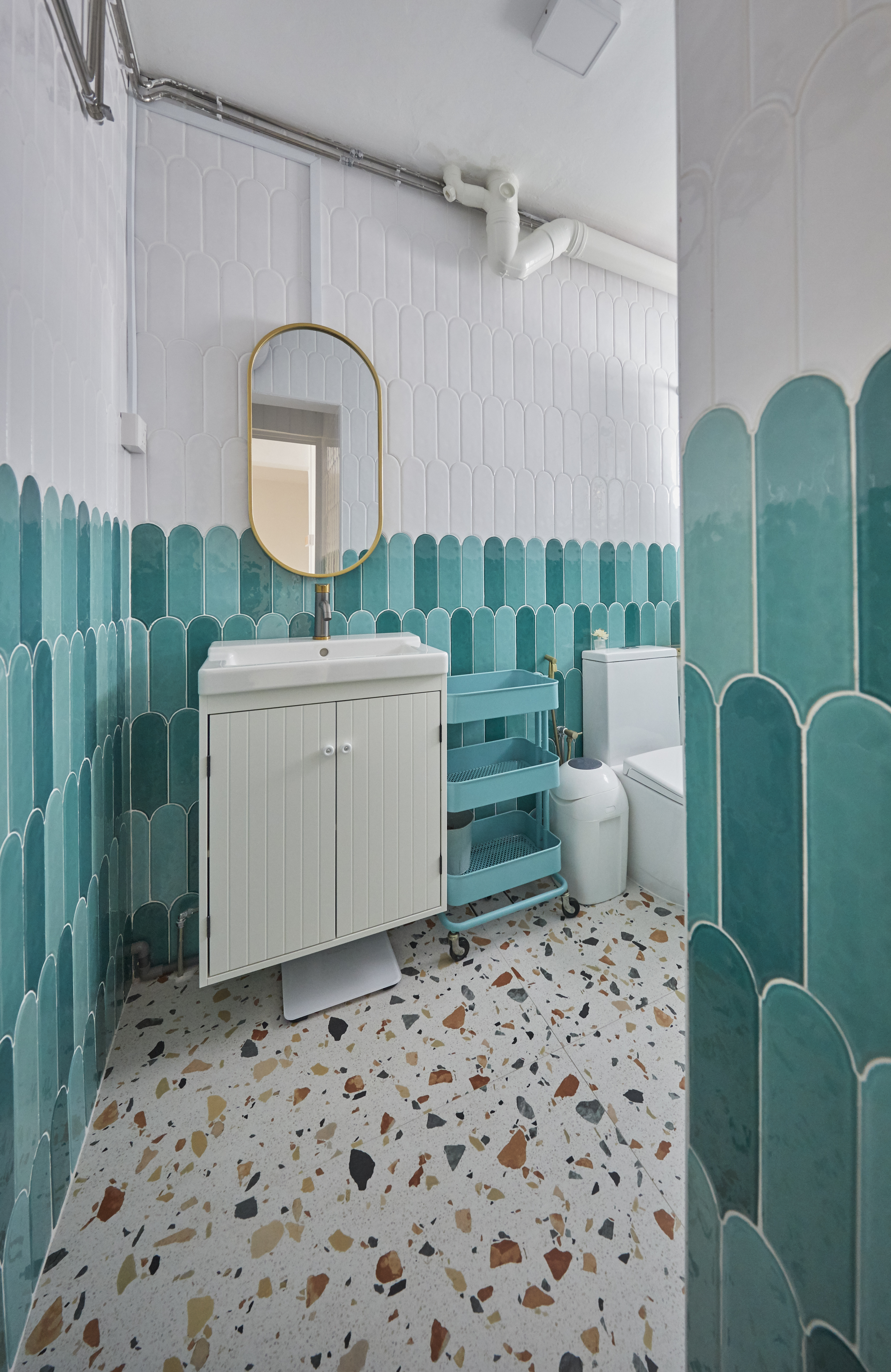 Guest bathroom - a pop of turquoise! - Modern bathroom with teal and white tiles, white vanity with gold mirror, teal and