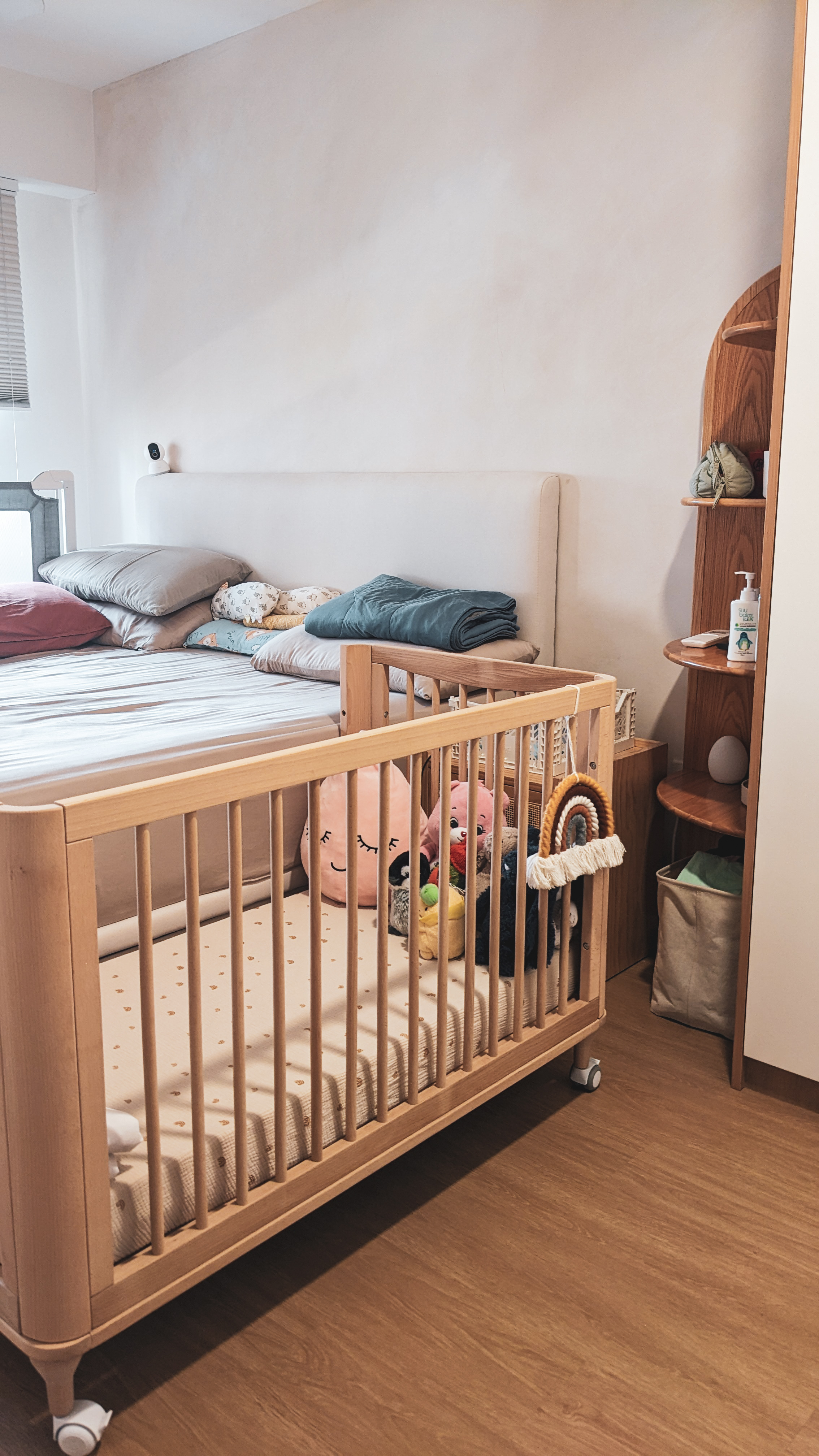 A Restful Night | Neutral & Natural - Wooden crib with baby, soft bedding, colorful pillows, wooden shelf, baby blanket, toy