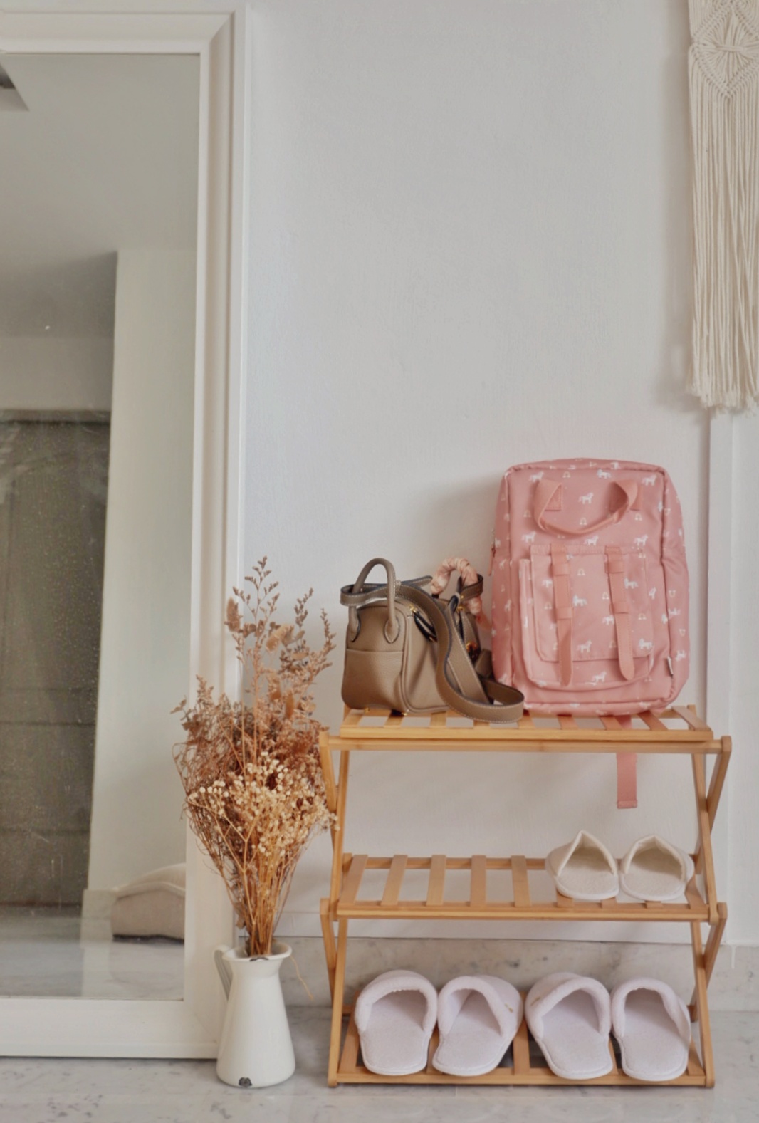Rustic Entrance Foyer  - vintage wooden shelf, minimalist decor, pastel pink backpack, beige handbag, white slippers, wooden