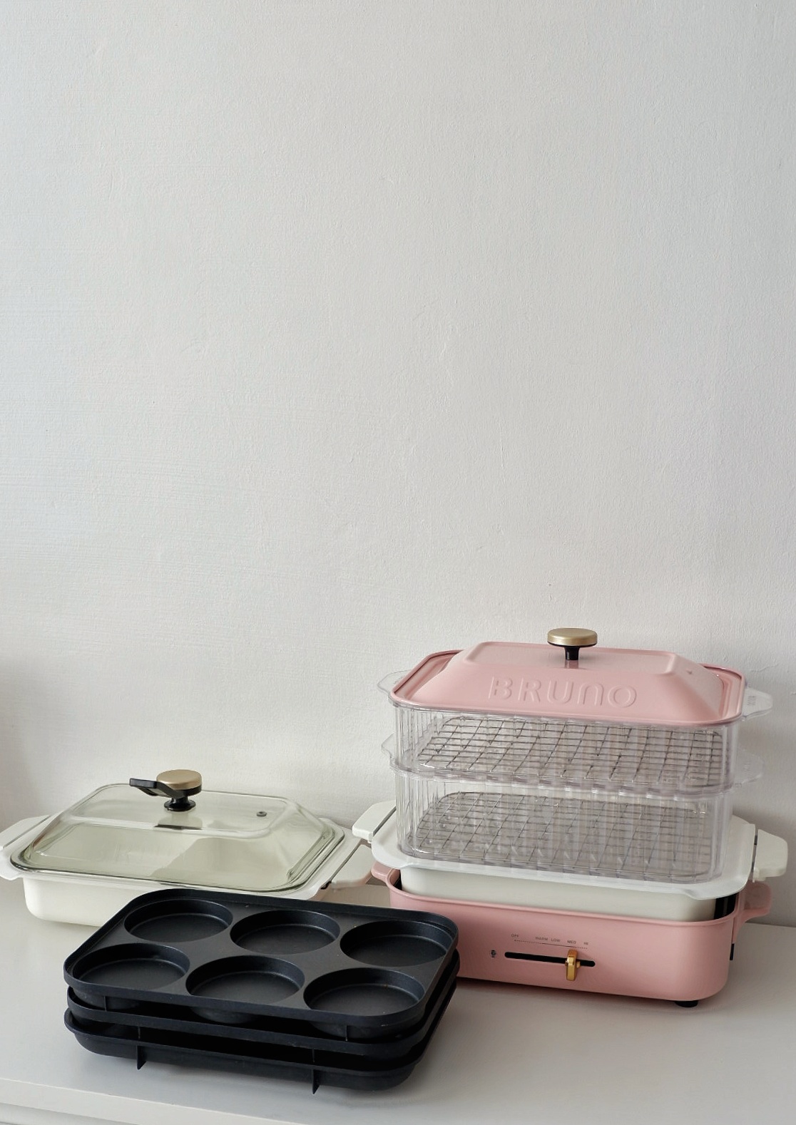 Favourite Purchases For The Home  - pink kitchen appliance, pink and white toaster, muffin tray, glass baking dish, silicone
