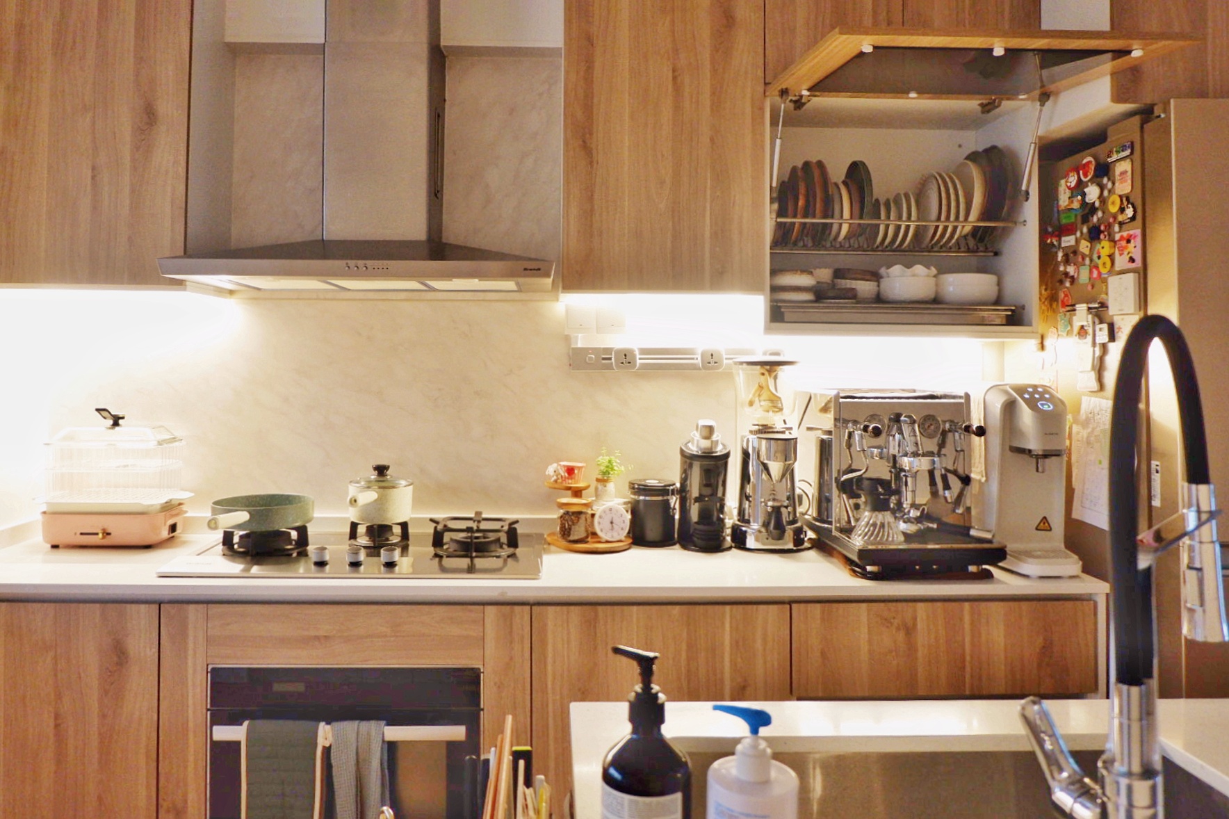 A heart of our house - Kitchen - Wooden kitchen cabinets, stainless steel range hood, white marble countertop, gas stove with