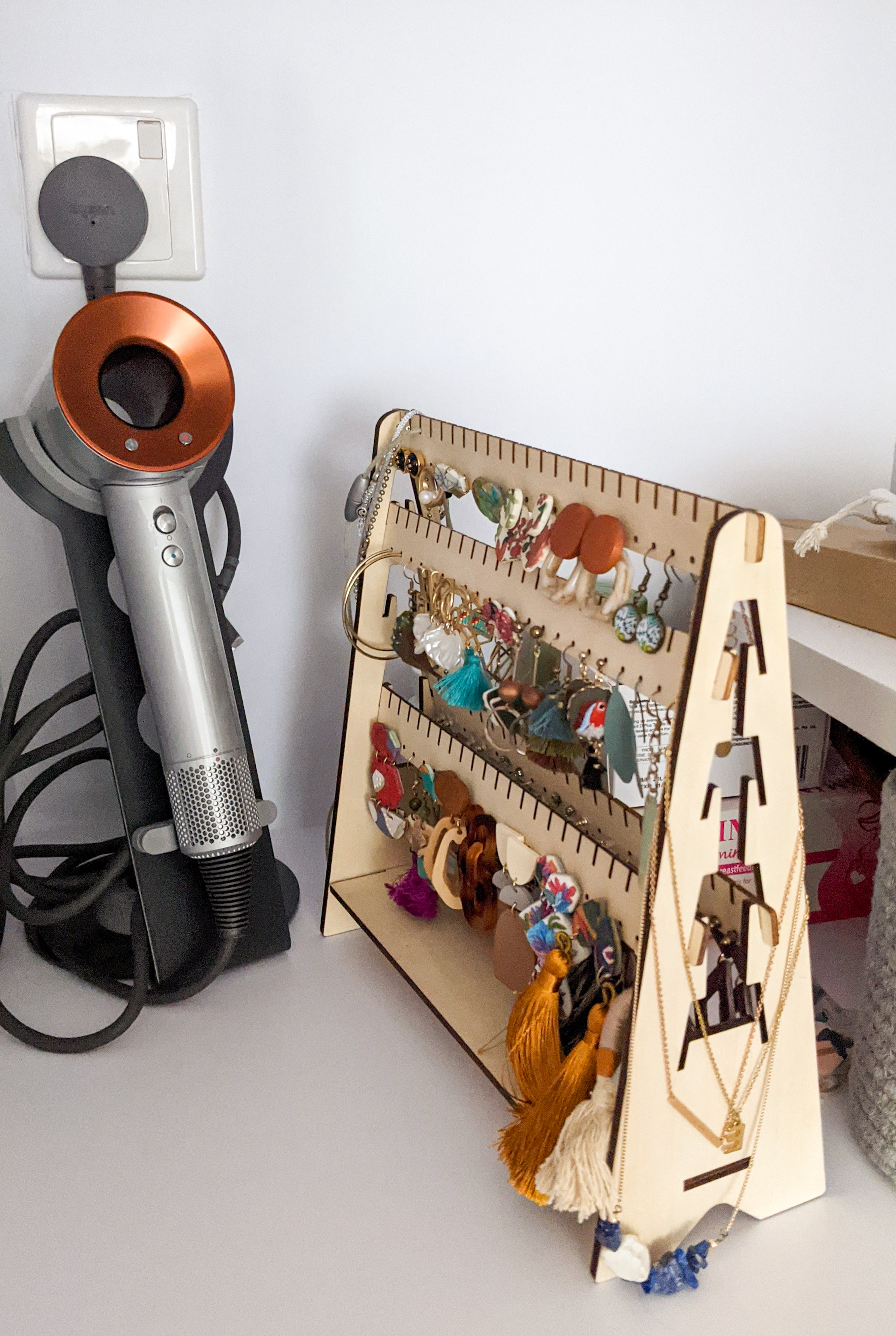Creating Statements | Every detail counts - hair dryer, charging station, metallic body, copper accents, power cord, wall