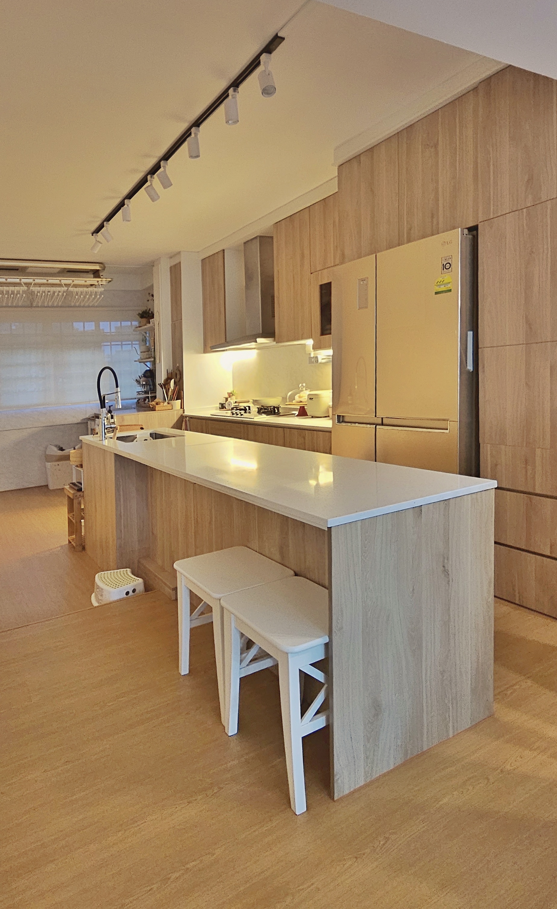 Transform a 4 rm HDB resale flat to a lovely home - Wooden kitchen island, modern kitchen, white countertops, stainless steel