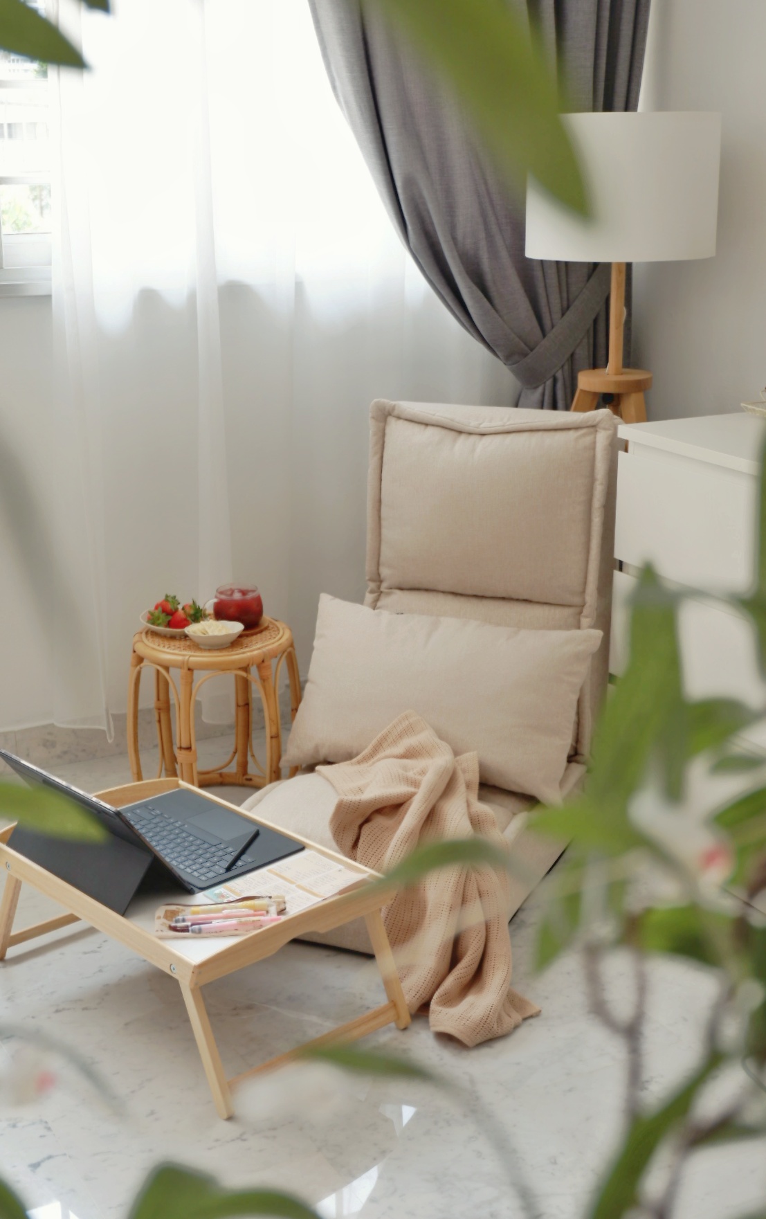 Transform a 4 rm HDB resale flat to a lovely home - Laptop on light beige sofa, cozy reading nook, soft curtains, natural