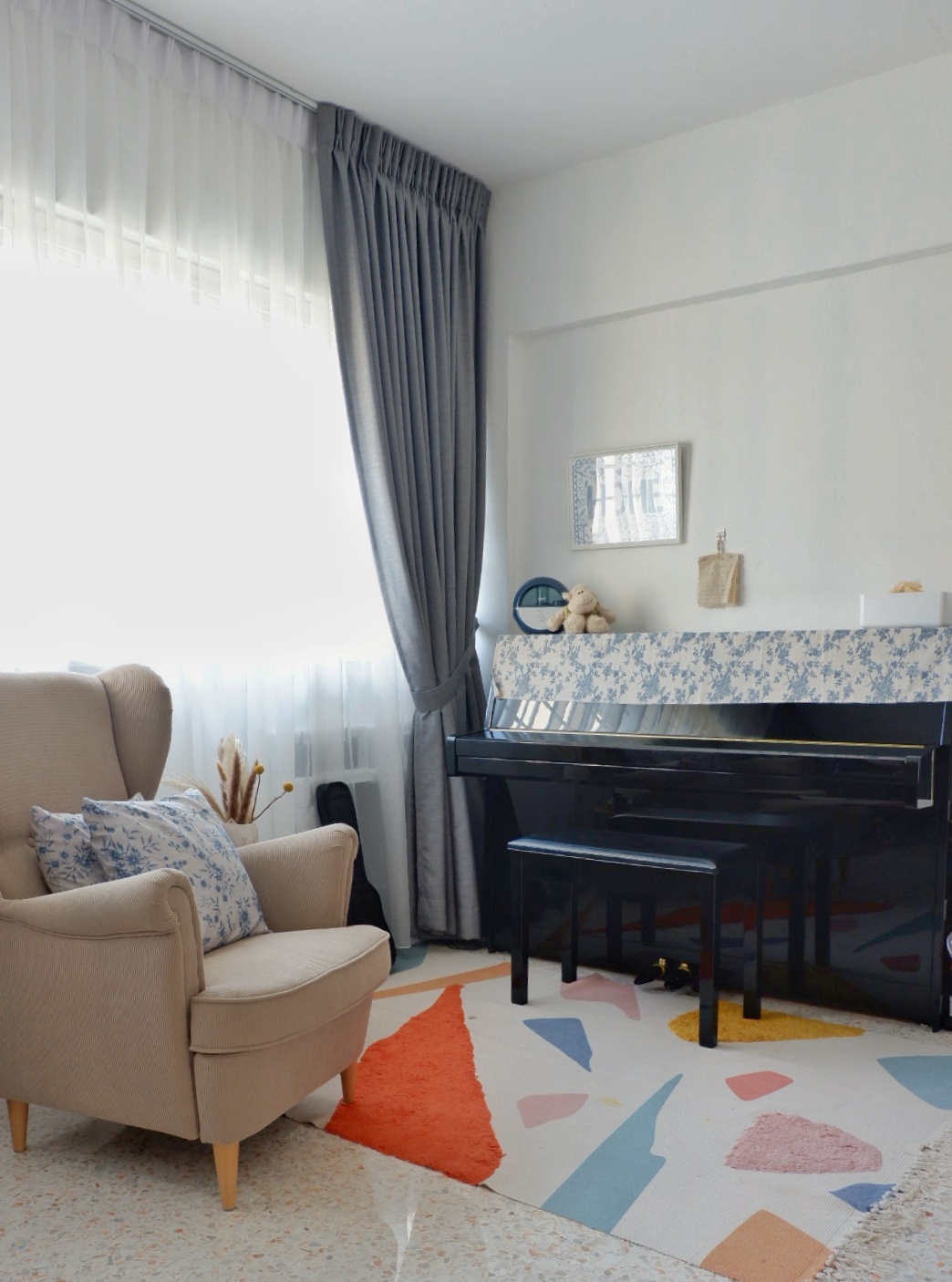 Transform a 4 rm HDB resale flat to a lovely home - Cream armchair, blue floral pillows, white and blue patterned tablecloth