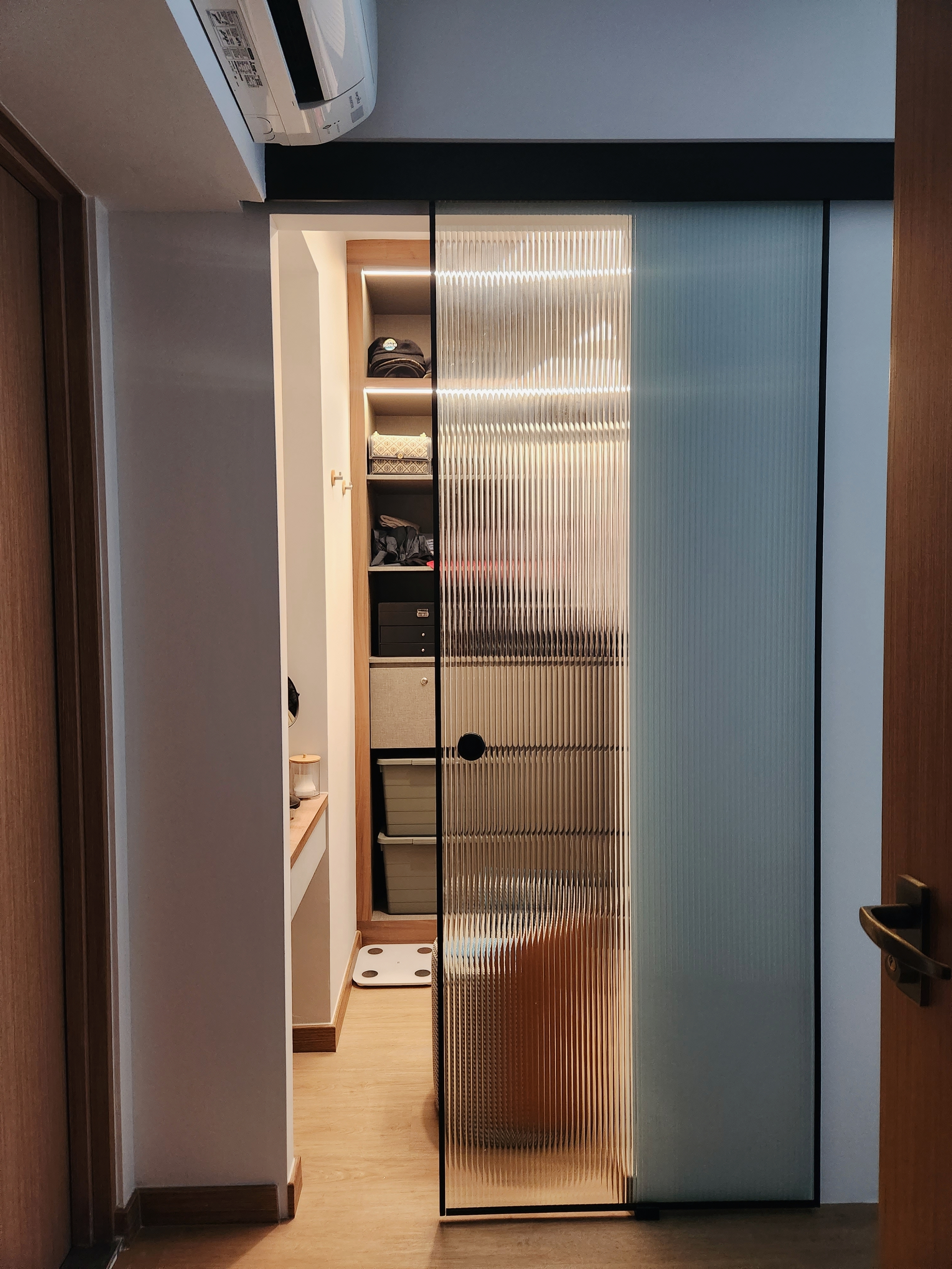 4 Room Warm, Curvy Contemporary Abode | Reno under $53k  - Wooden door, modern interior, hallway, glass partition, vertical