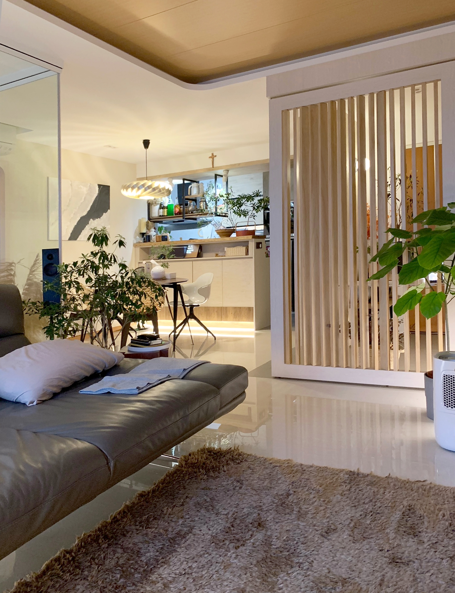 5 rooms resale HDB with Japanese inspired interior - Modern living room, cozy seating, gray leather couch, white pillows