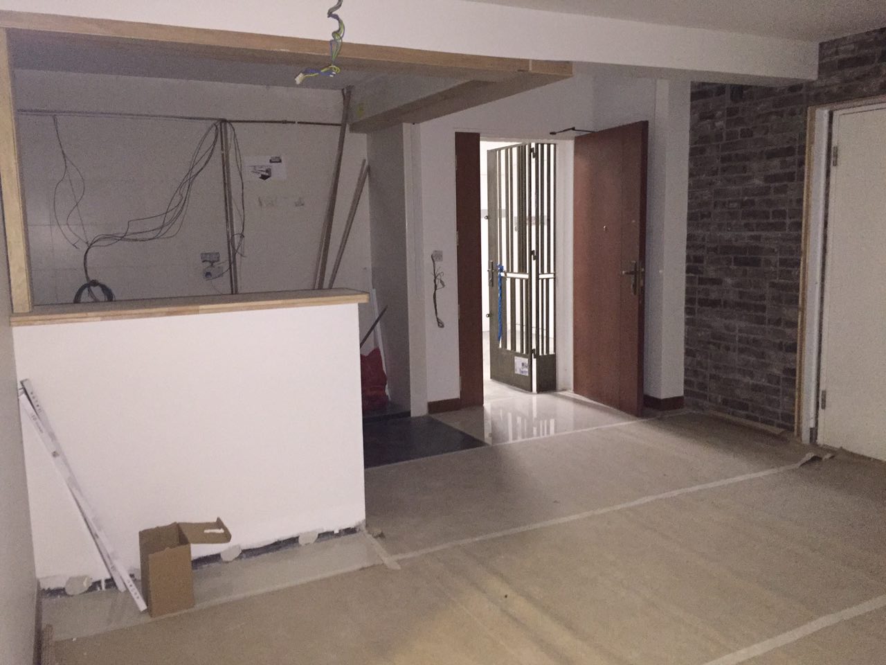 A Boho Paradise Home - Under construction area, unfinished walls, exposed wiring, wooden beams, tiled floor, unfinished