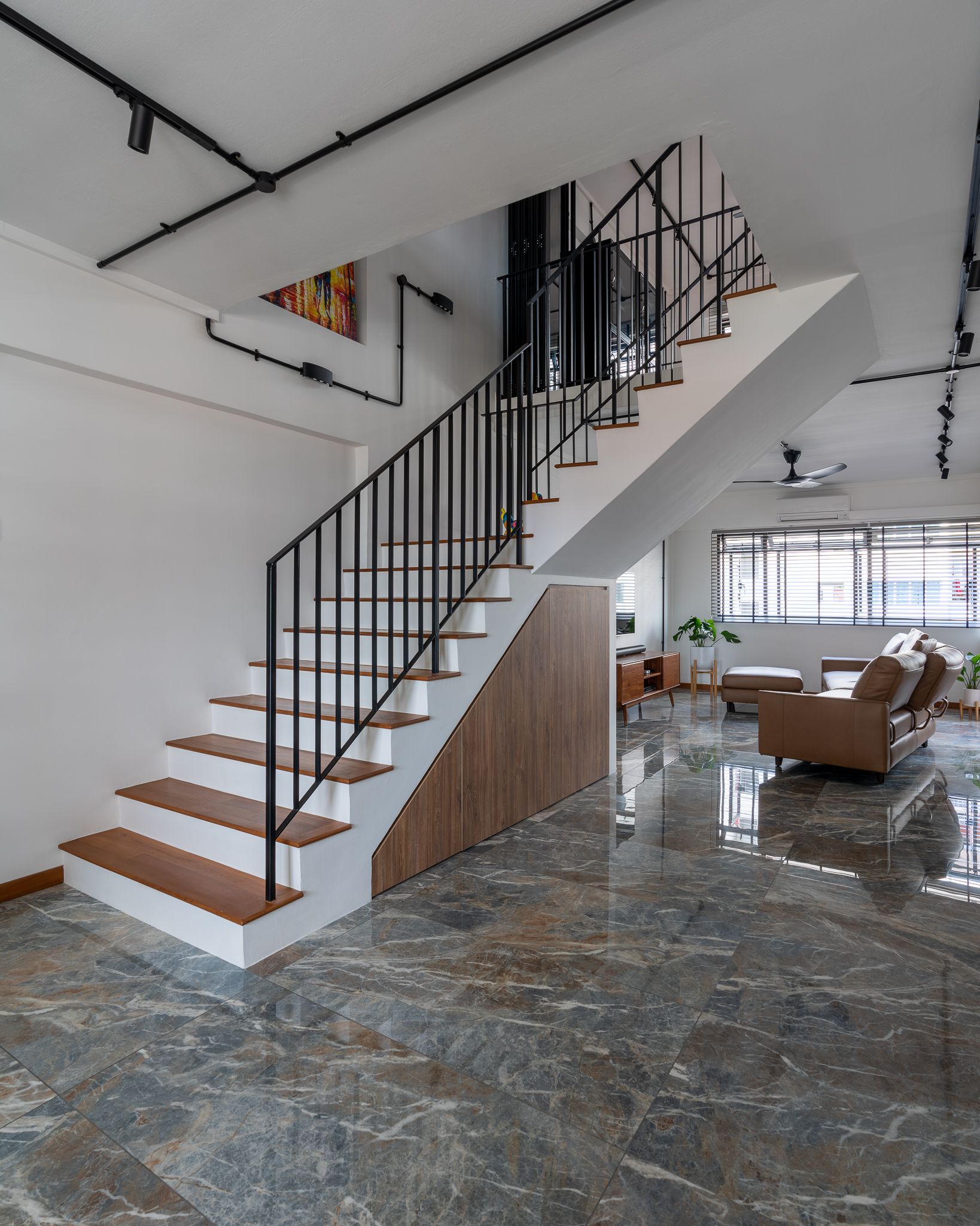 An executive maisonette, deconstructed and reassembled - Modern minimalist interior, sleek staircase, black metal railing