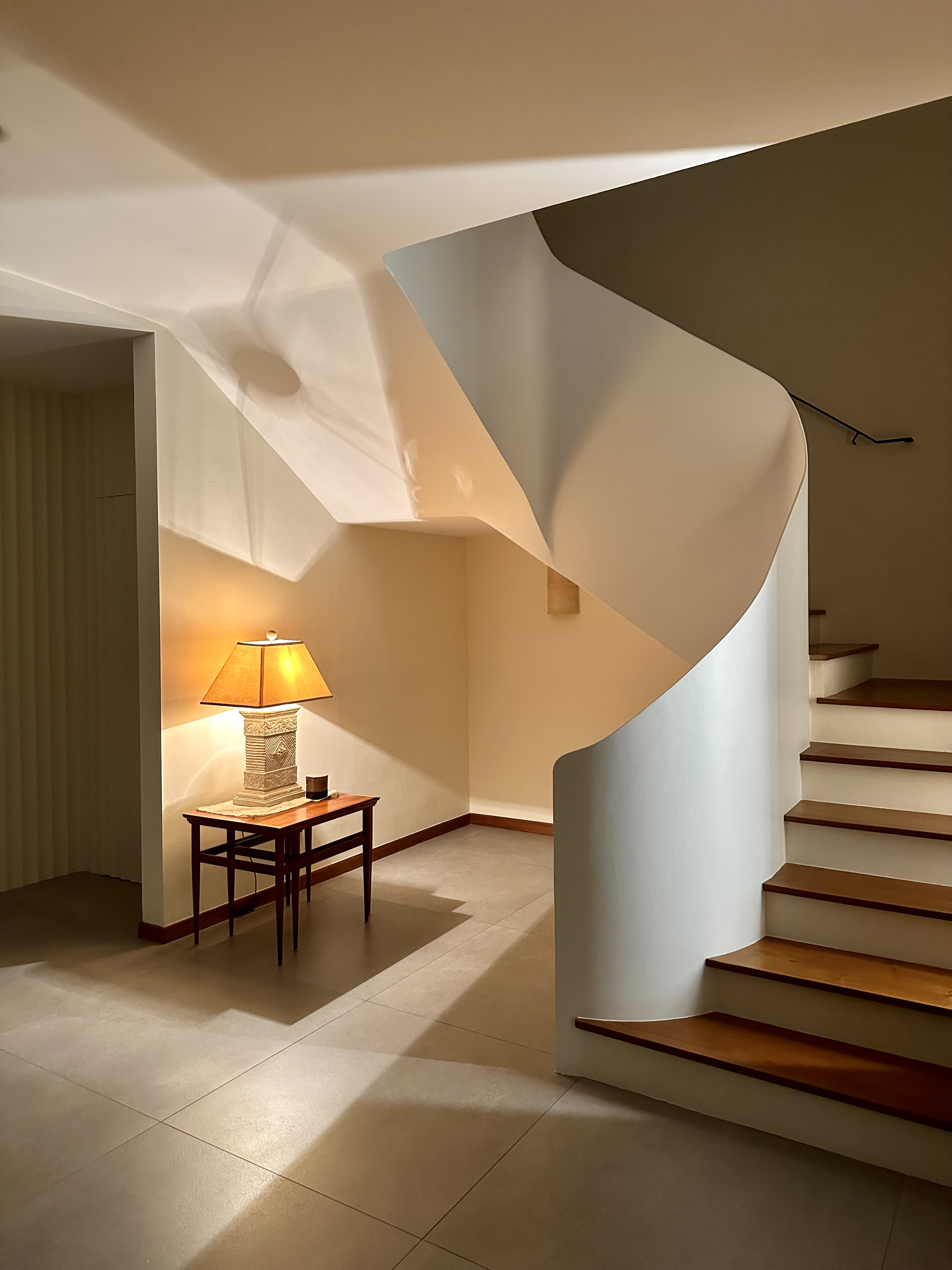 60’s grilles in a newly constructed house - Modern minimalist interior, elegant staircase, wooden steps, soft lighting