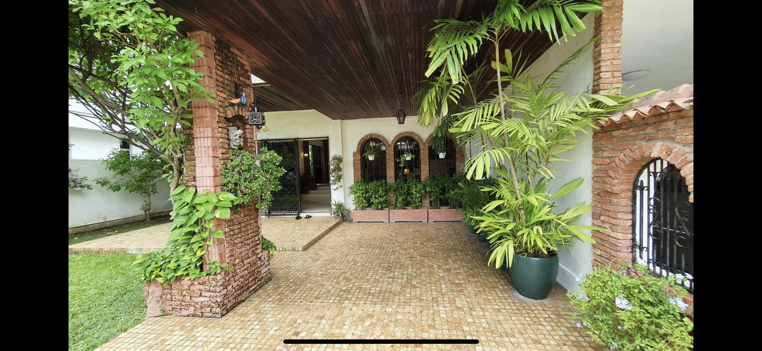 60’s grilles in a newly constructed house - Garden, patio, brick structure, lush greenery, tropical plants, outdoor area