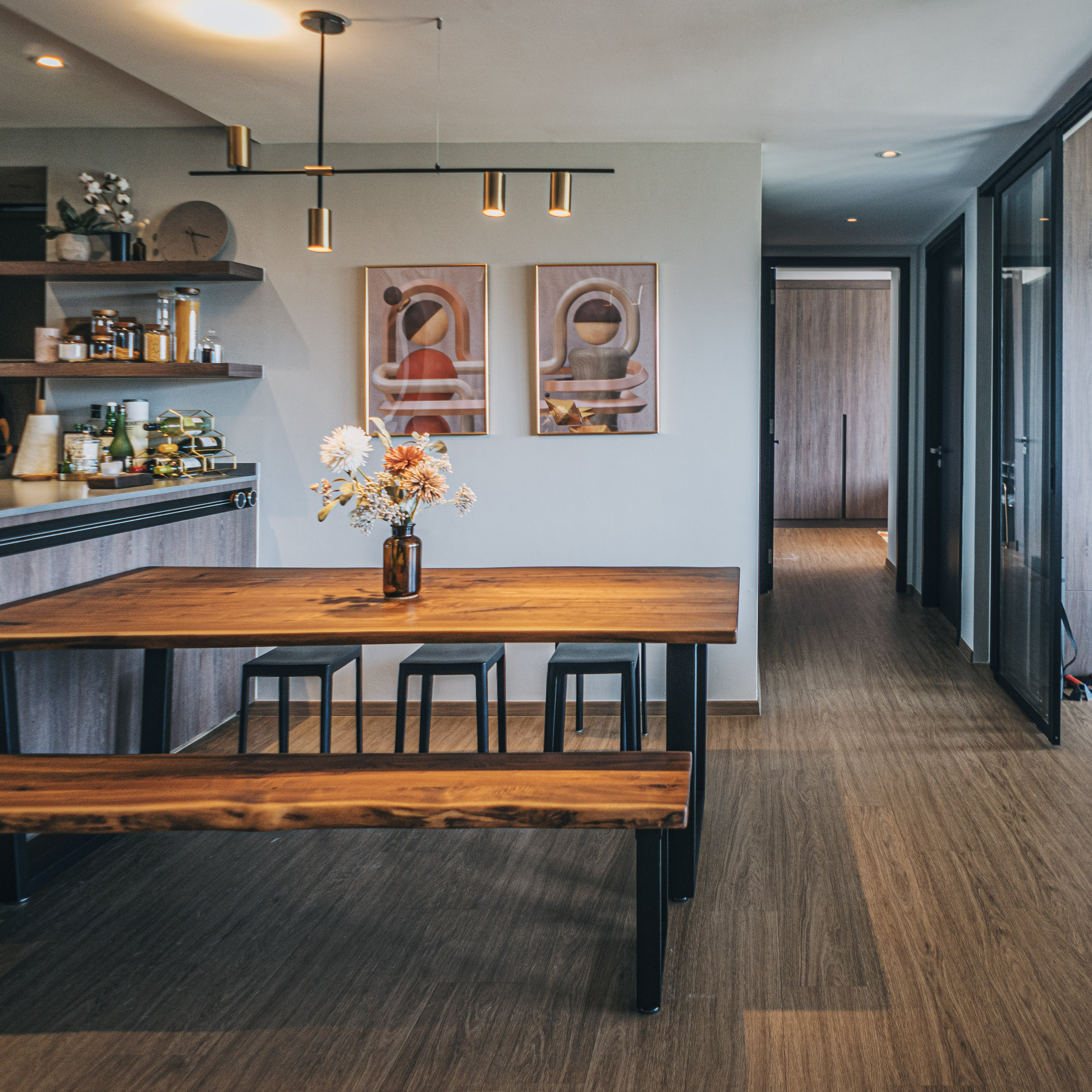 Maximising 1,109sqft - Our open-concept space planning - modern kitchen, dining area, wooden table, black stools, minimalist