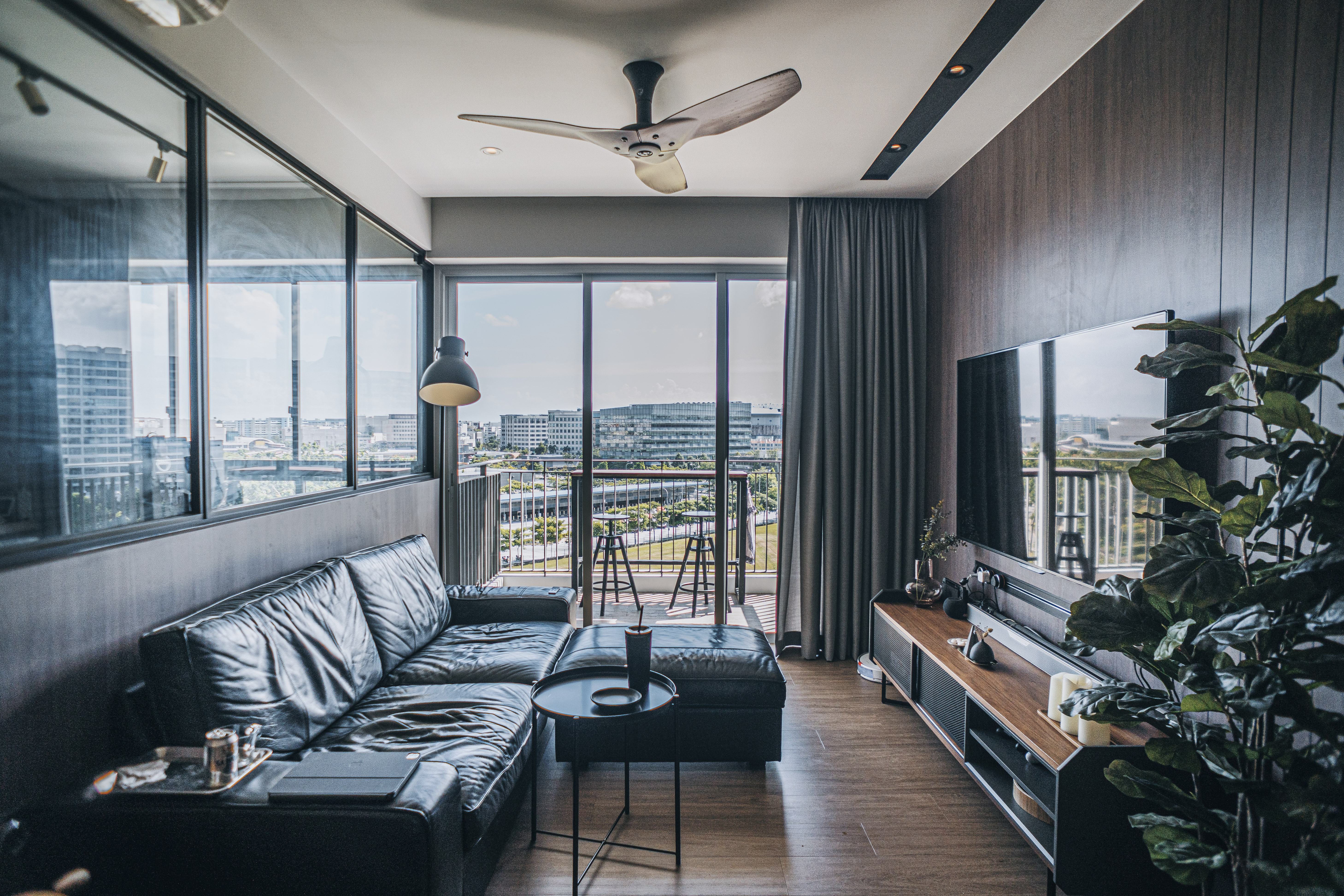 Maximising 1,109sqft - Our open-concept space planning - Modern living room with large windows, panoramic city view, dark